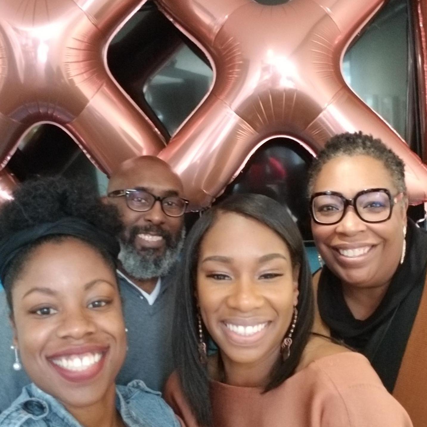 Marquicia with sister Renyshia and family friends, Janna and Richard