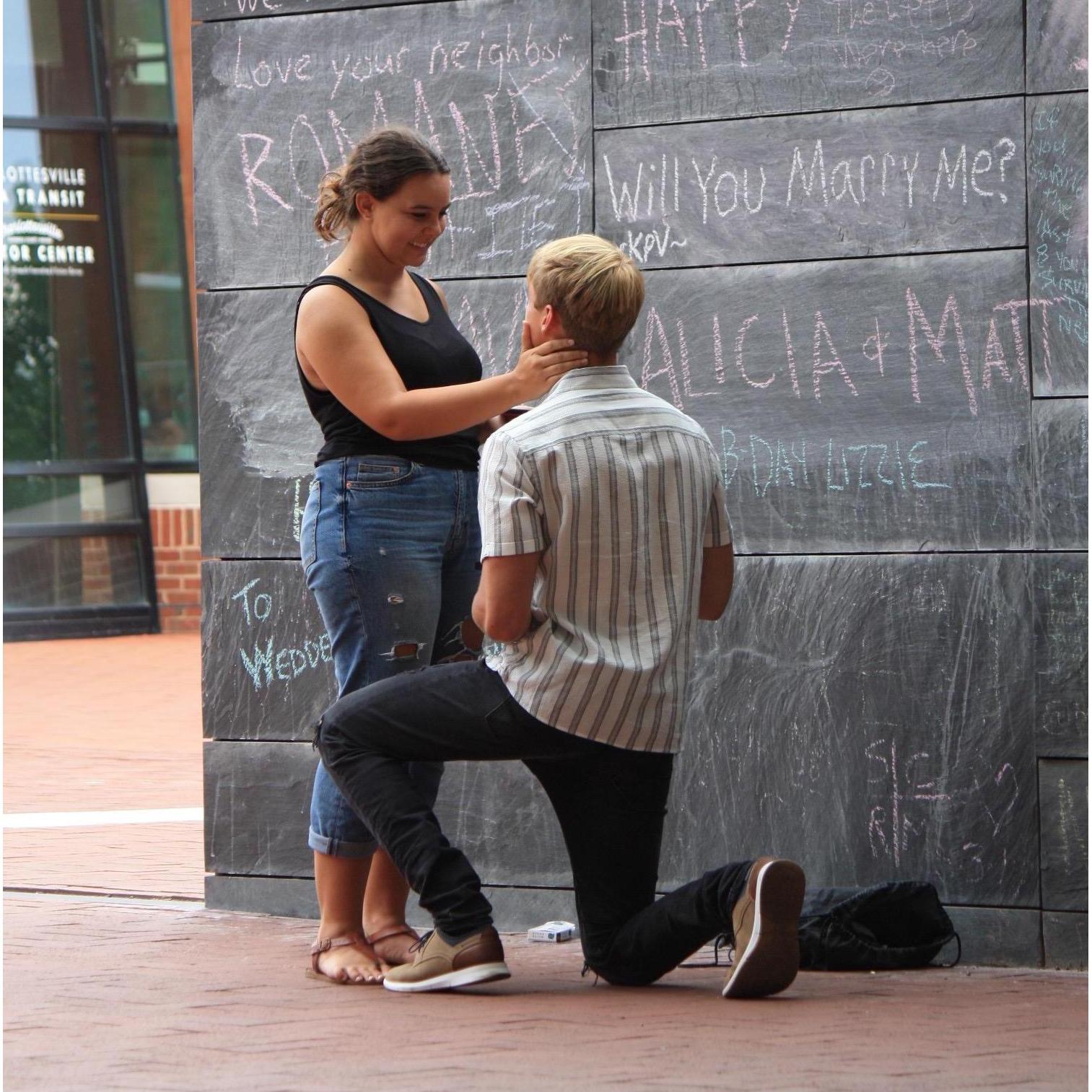 Keller took Lauren to the Freedom of Speech Wall where he pulled out chalk to have a “drawing” competition on either side of the wall. He won! He replaced her purity ring with an engagement ring.