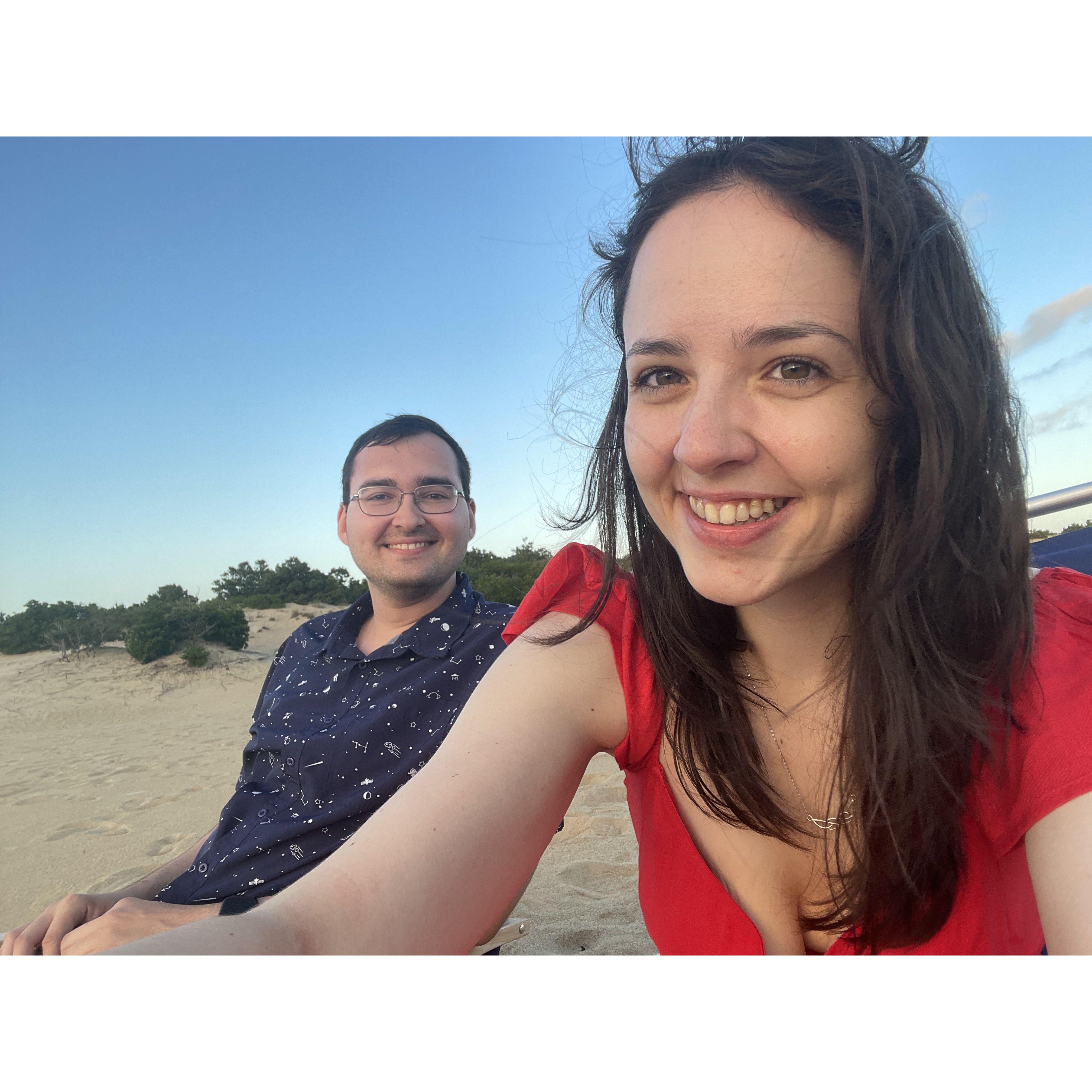 Us on Jockey's Ridge watching the sunset after getting engaged!