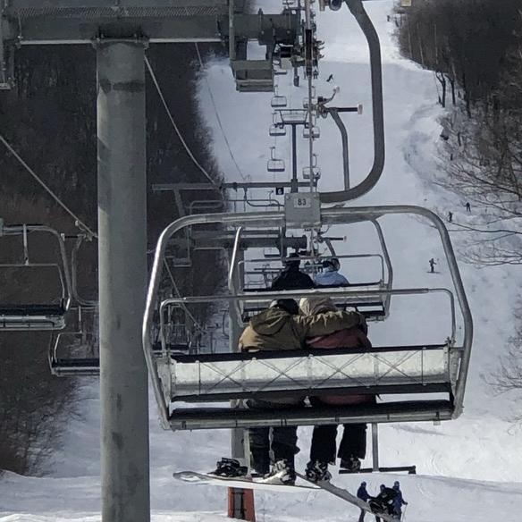 Ski lift rides in Stowe, VT.