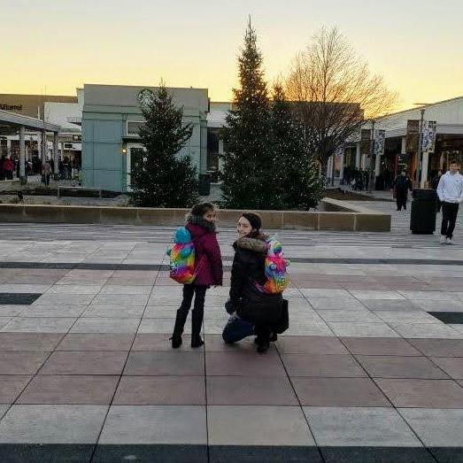 Ellie and Monica with there build a bear backpacks after shopping for new outfits