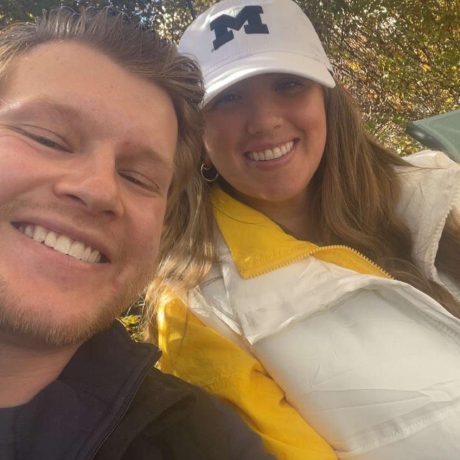 Proof that Perry can step away from his foghorn duties at UofM football games to smile for the camera