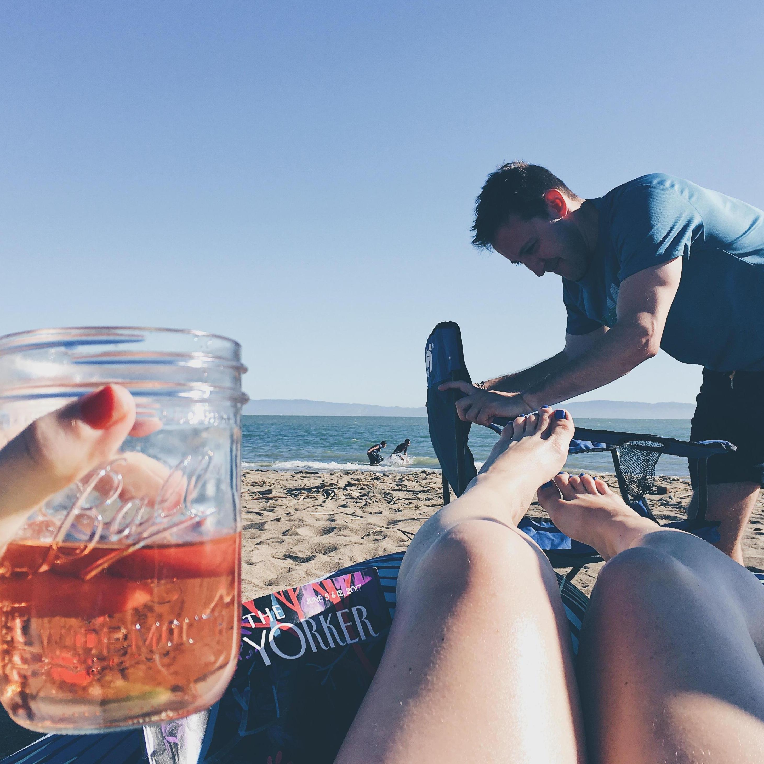 Reading and not drinking on our new beach