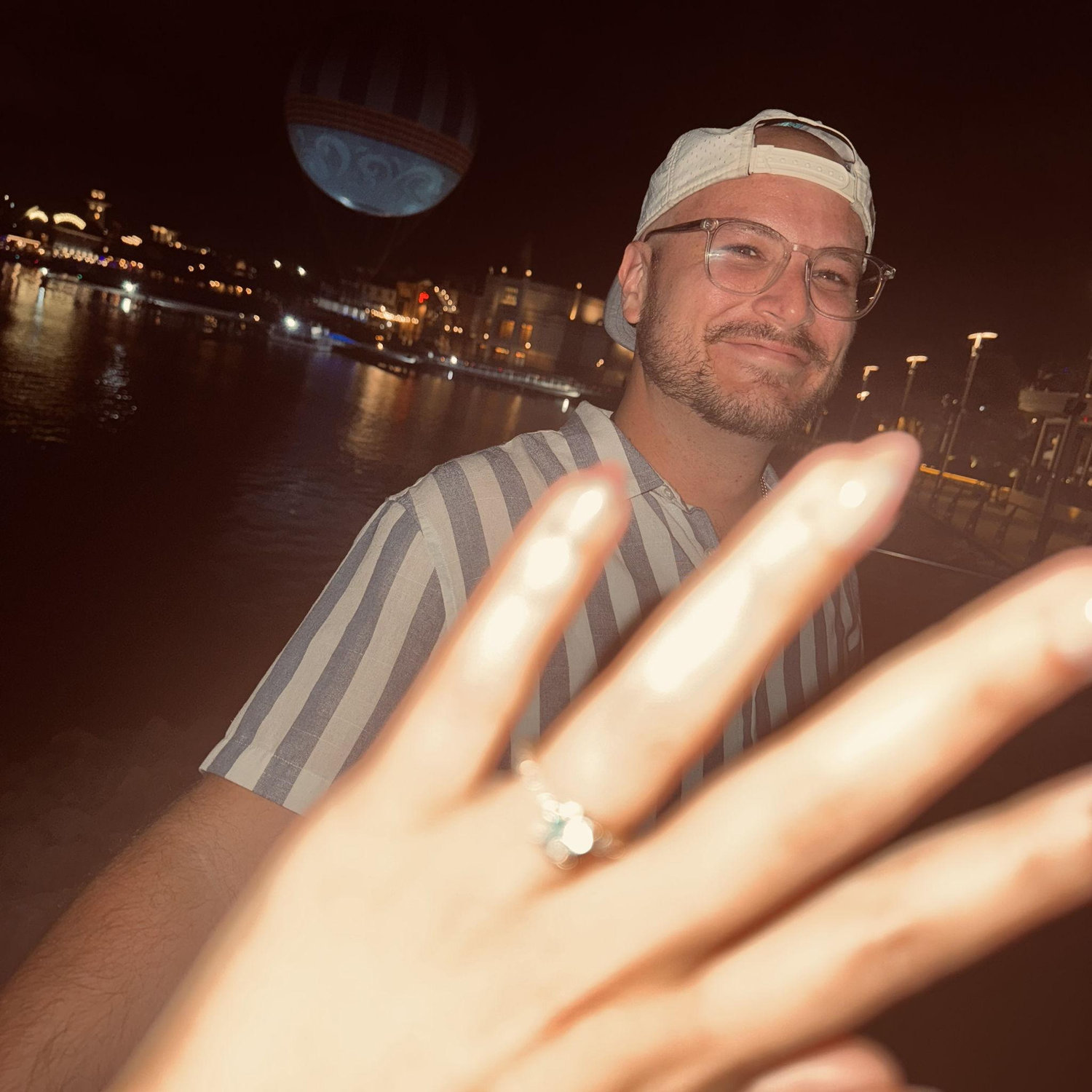 The night we got engaged! Right in front of a hot air balloon, next to the water, in Disney Springs. Just us two!