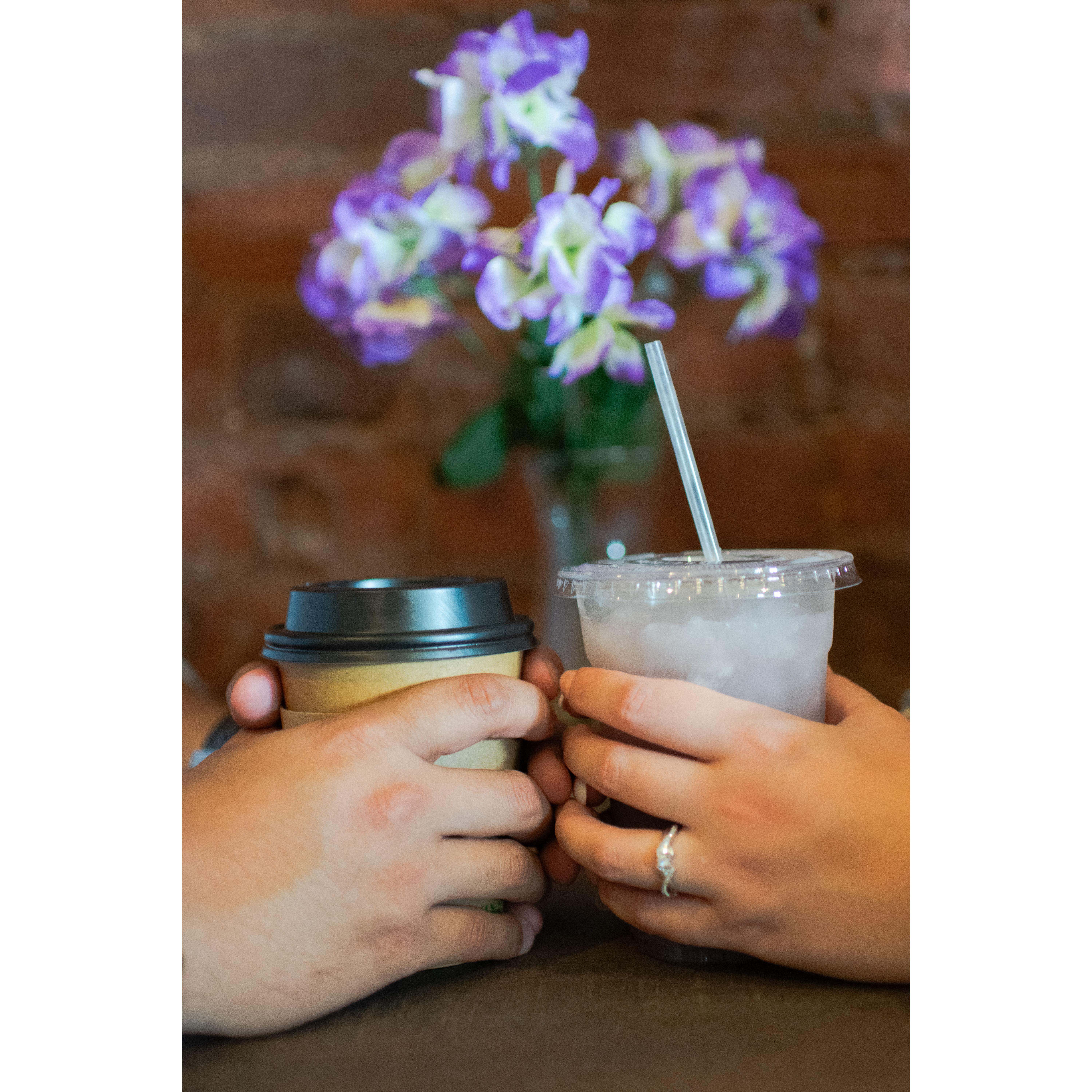 Engagement Picture - We went to a coffee shop. We're both coffee addicts (hence the coffee cart at the wedding)—a picture taken by Ryan Hooper.