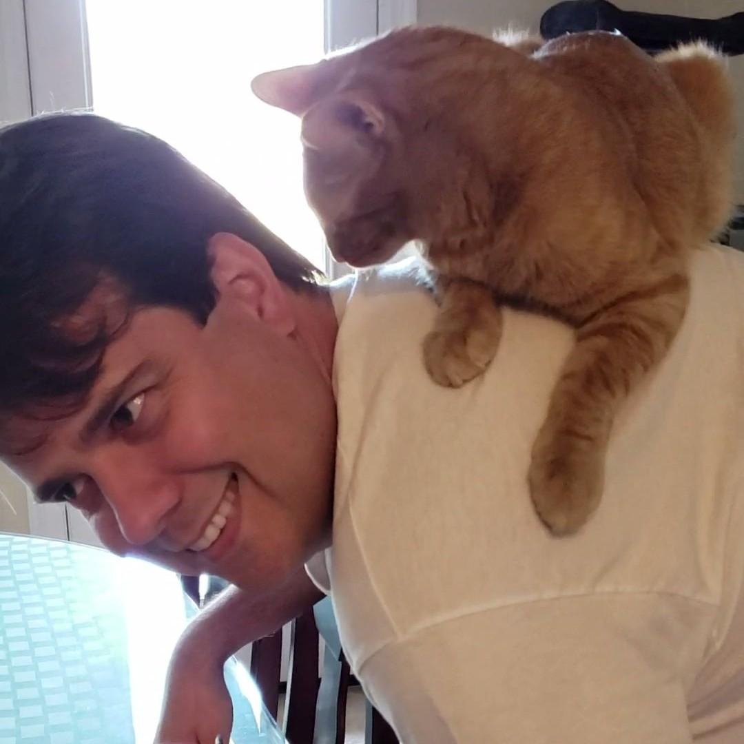 Blitz loves climbing onto Brad's back