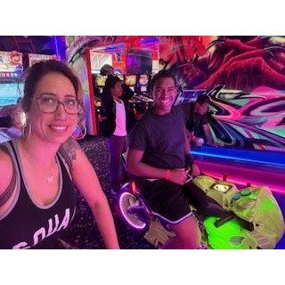 Mom kicking boy's arcade behind!
