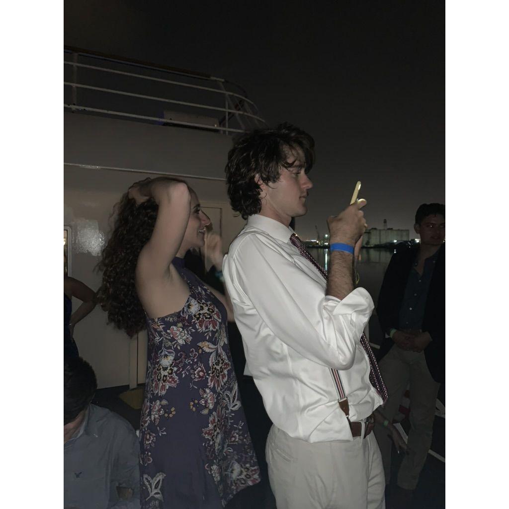 Photo taken at a party on a boat during their time at UD, BEFORE they met! (You can see Nic off to the right side)
