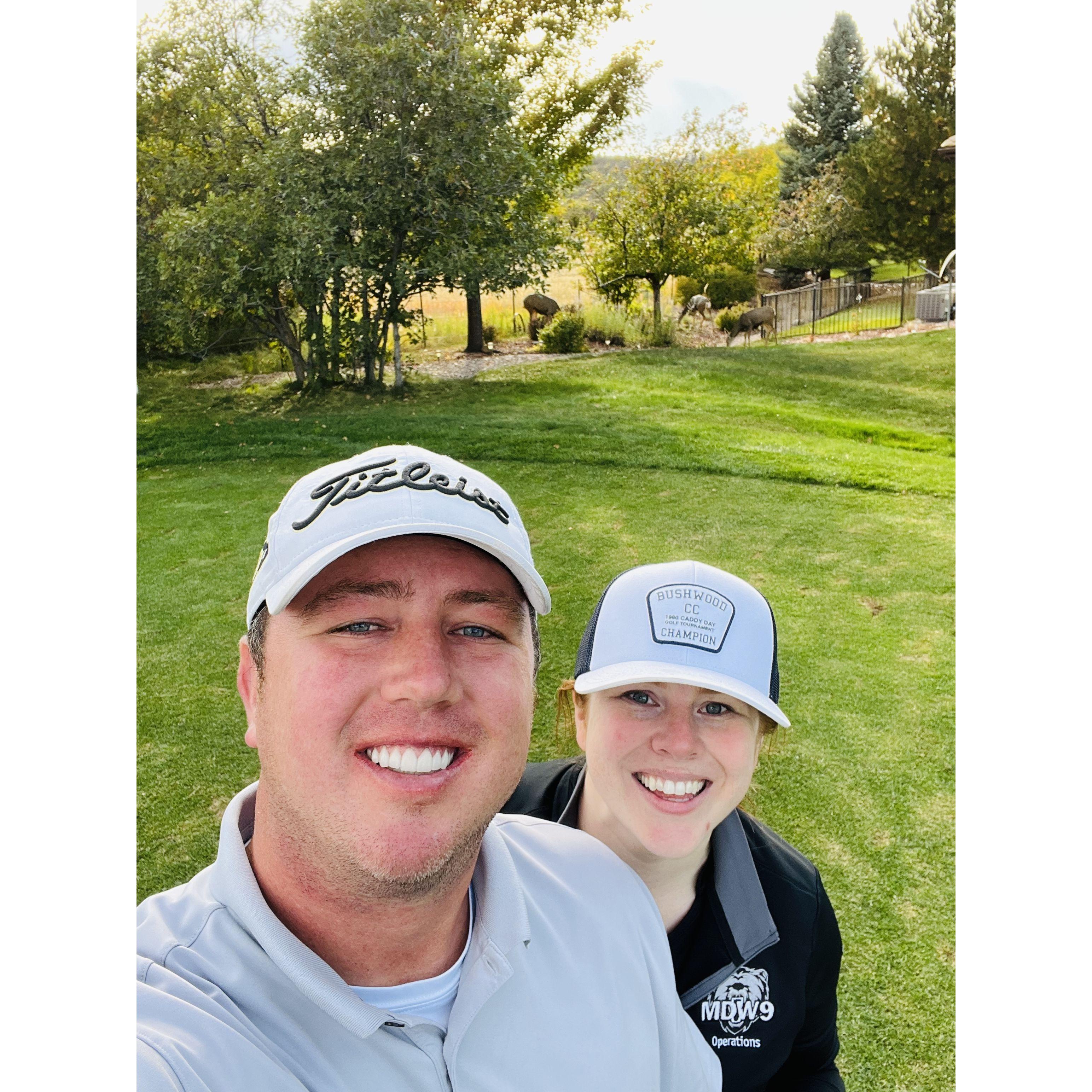 Zach started teaching Sara how to golf and they enjoy going out and spending time with this outdoor hobby. There is a deer in the back of this picture we tried to capture!