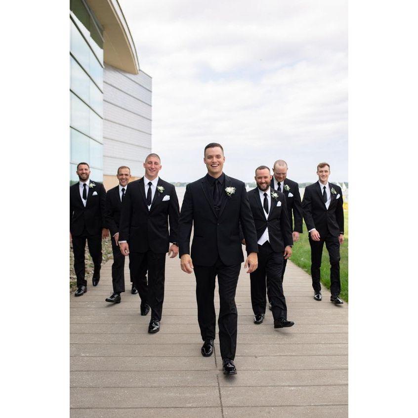 You can't go wrong with a black tuxedo or a sharp suit. Remember, this is a black-tie event, so elevate your look with classic cuts and a polished appearance.
