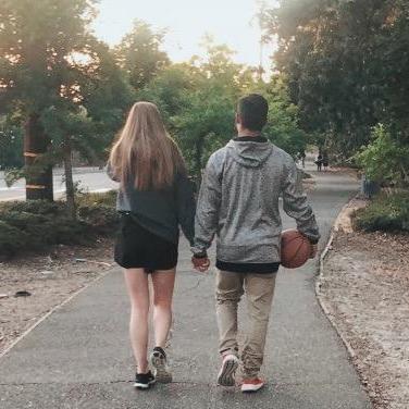 An oldie but goodie! This is us walking to the court where we originally met playing pickup basketball in 2018.