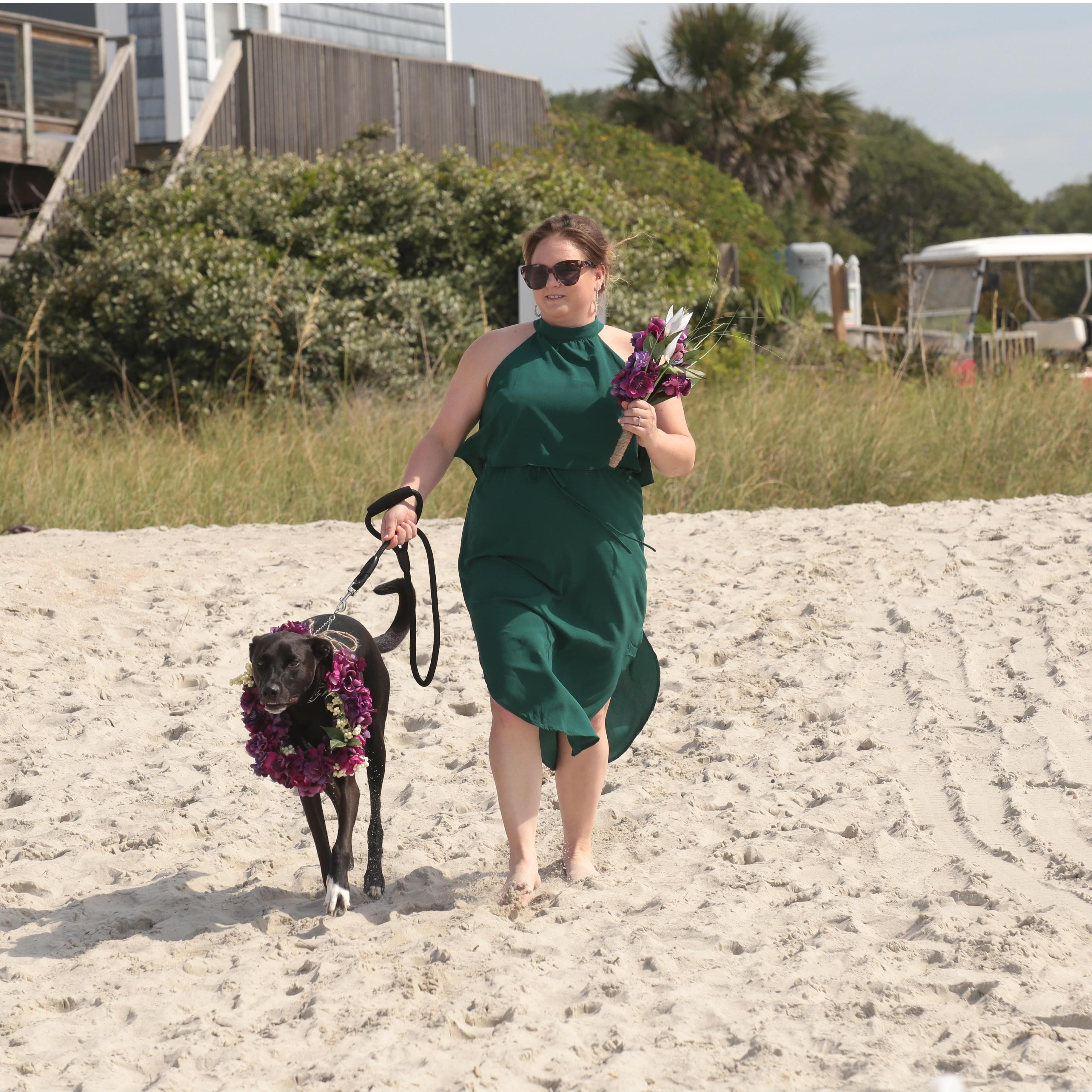 Maid of honor, Amanda, with flower "girl", Colt, walking down the isle