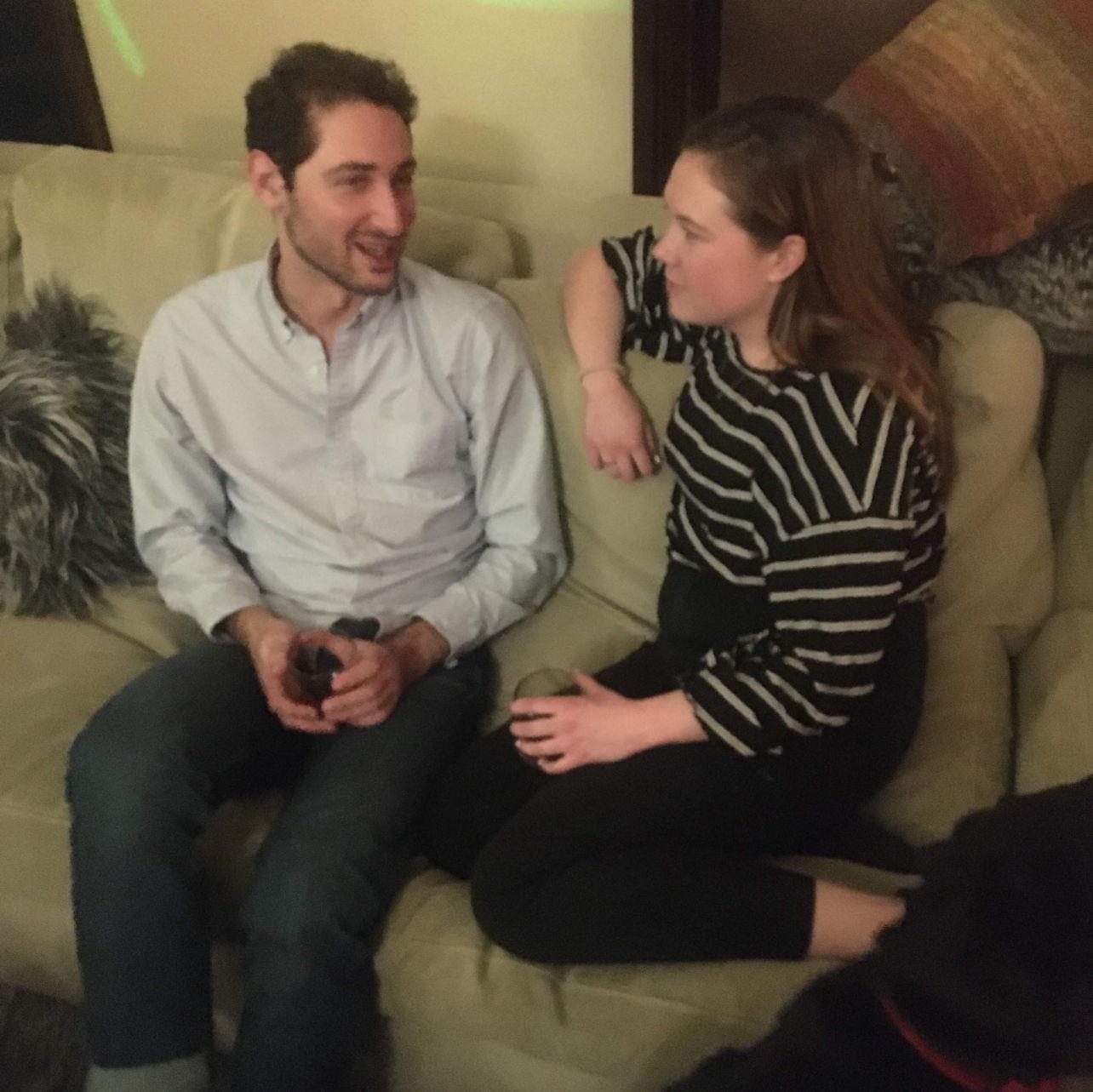 Our friend snapped this photo of us chatting "as friends" at a party in December 2019. We started officially dating a week later!