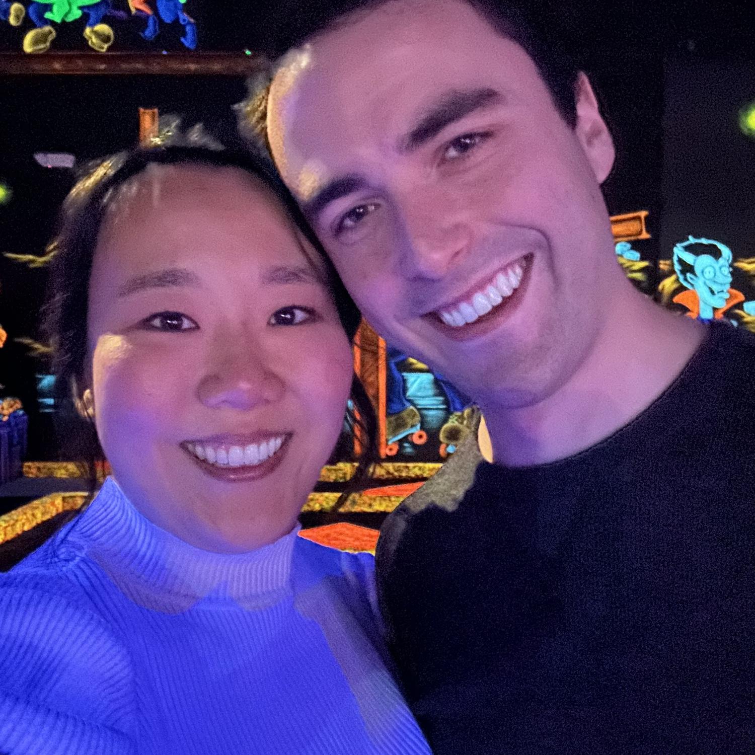 Celebrating our first anniversary where it all began — black light mini golf!
