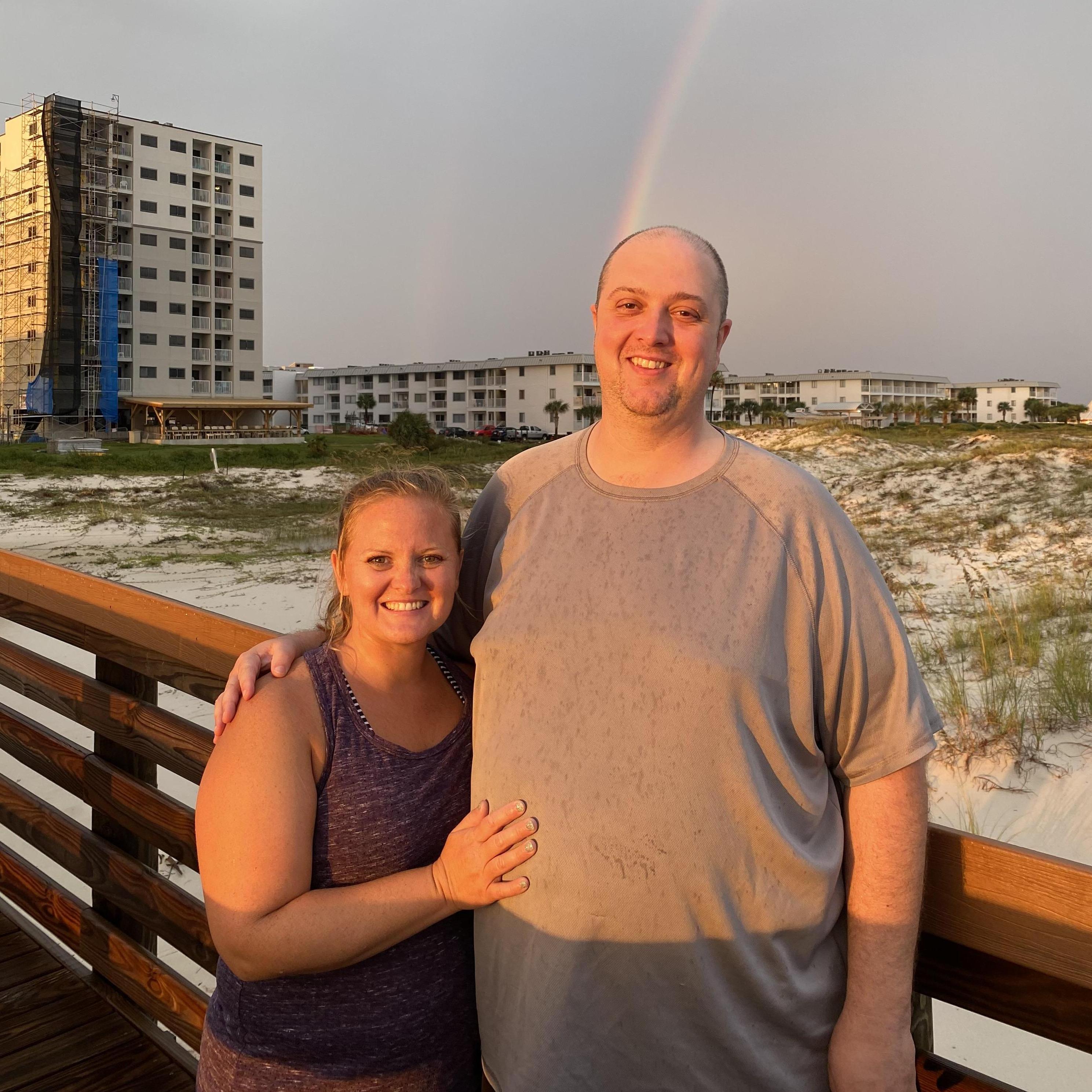 There was a beautiful double rainbow on a cloudy day.