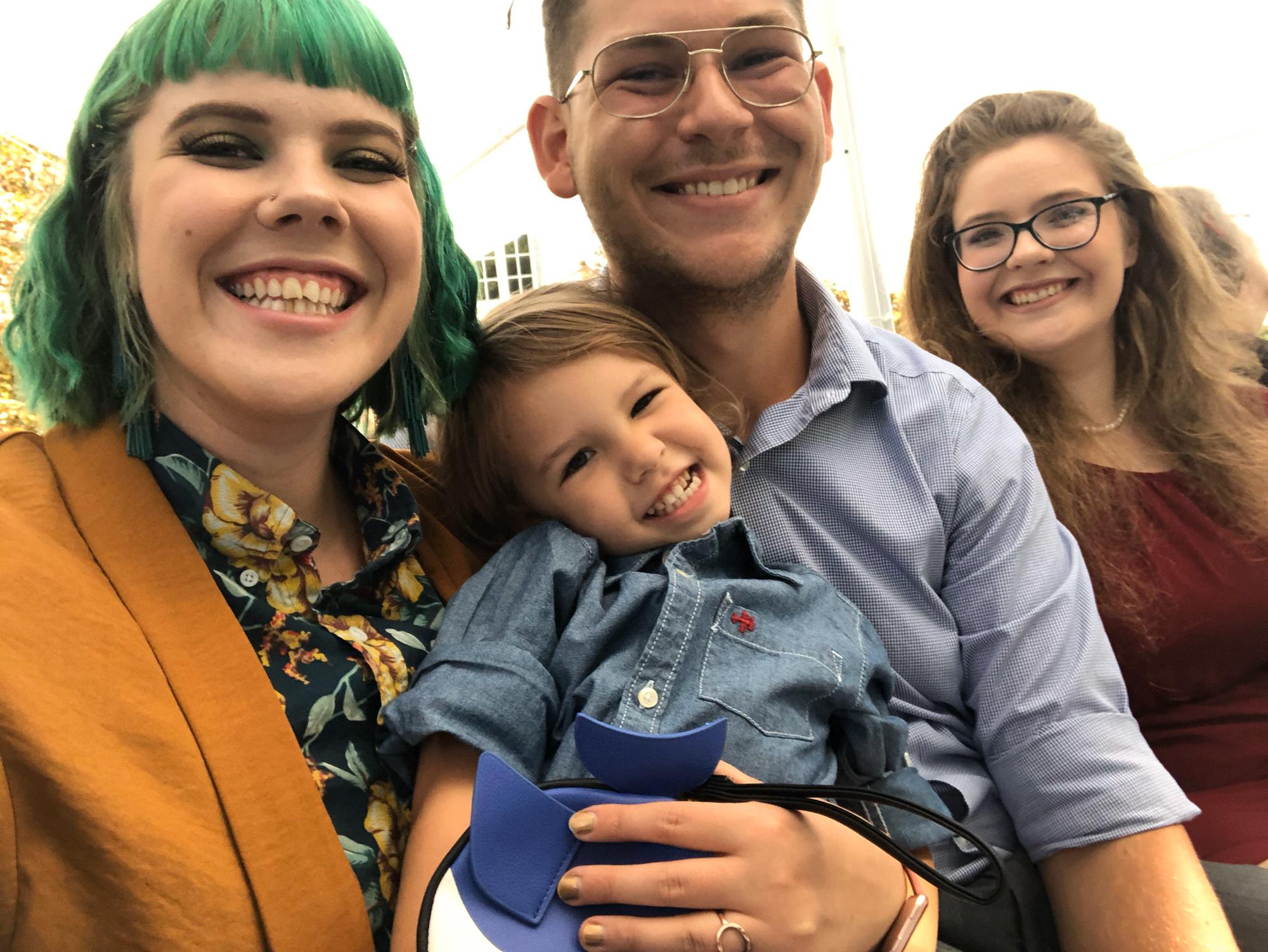 With Maggie’s sister and nephew at a family wedding (2019).
