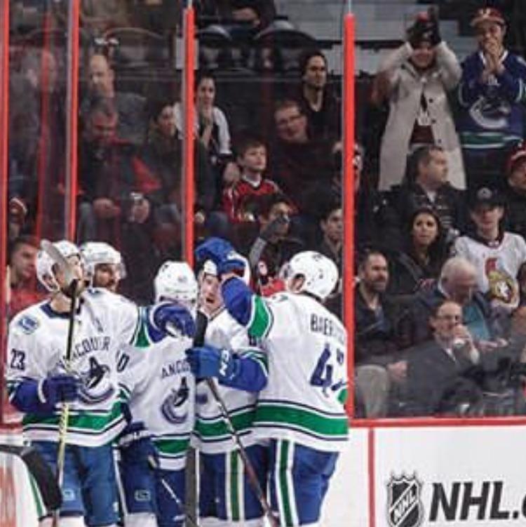 When we saw Elias Petterson score his first NHL hat trick AND made it into the Canucks social media post about it! We're easy to spot as the only ones standing and cheering amongst all the Sens fans.