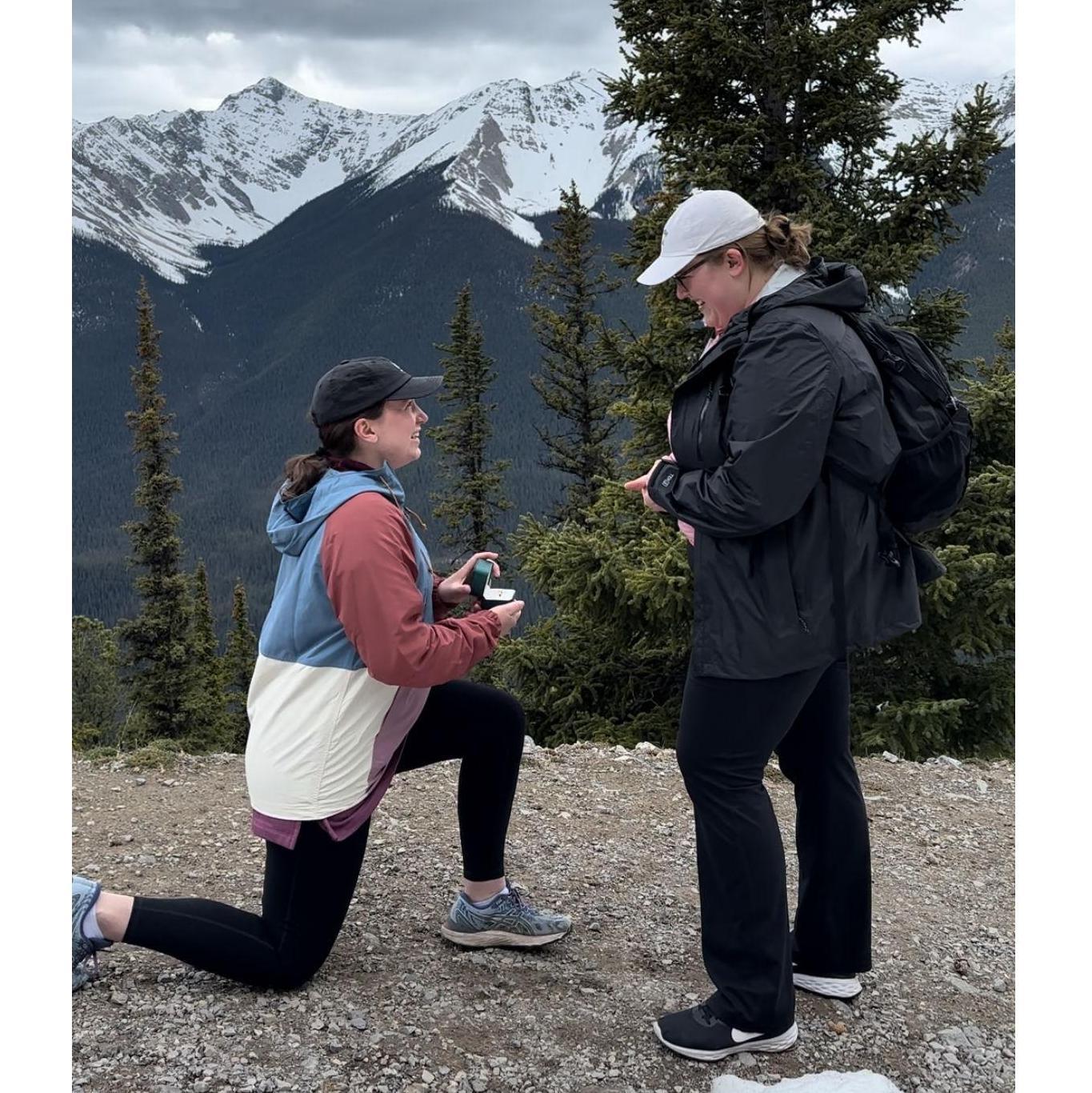 Mikala proposing to Johna on a mountain in Banff, Canada