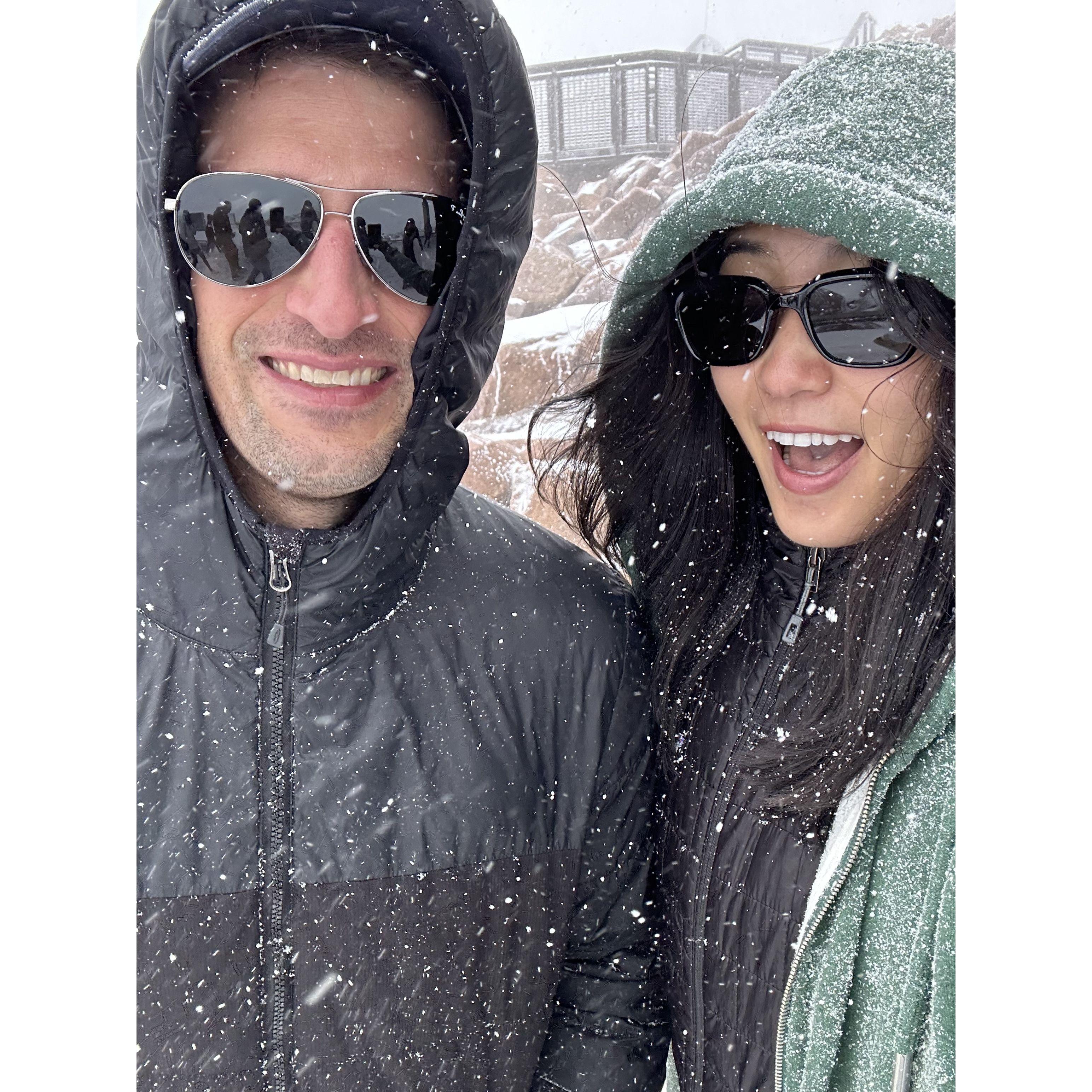Smiling but crying in snow, Pikes Peak, Colorado.