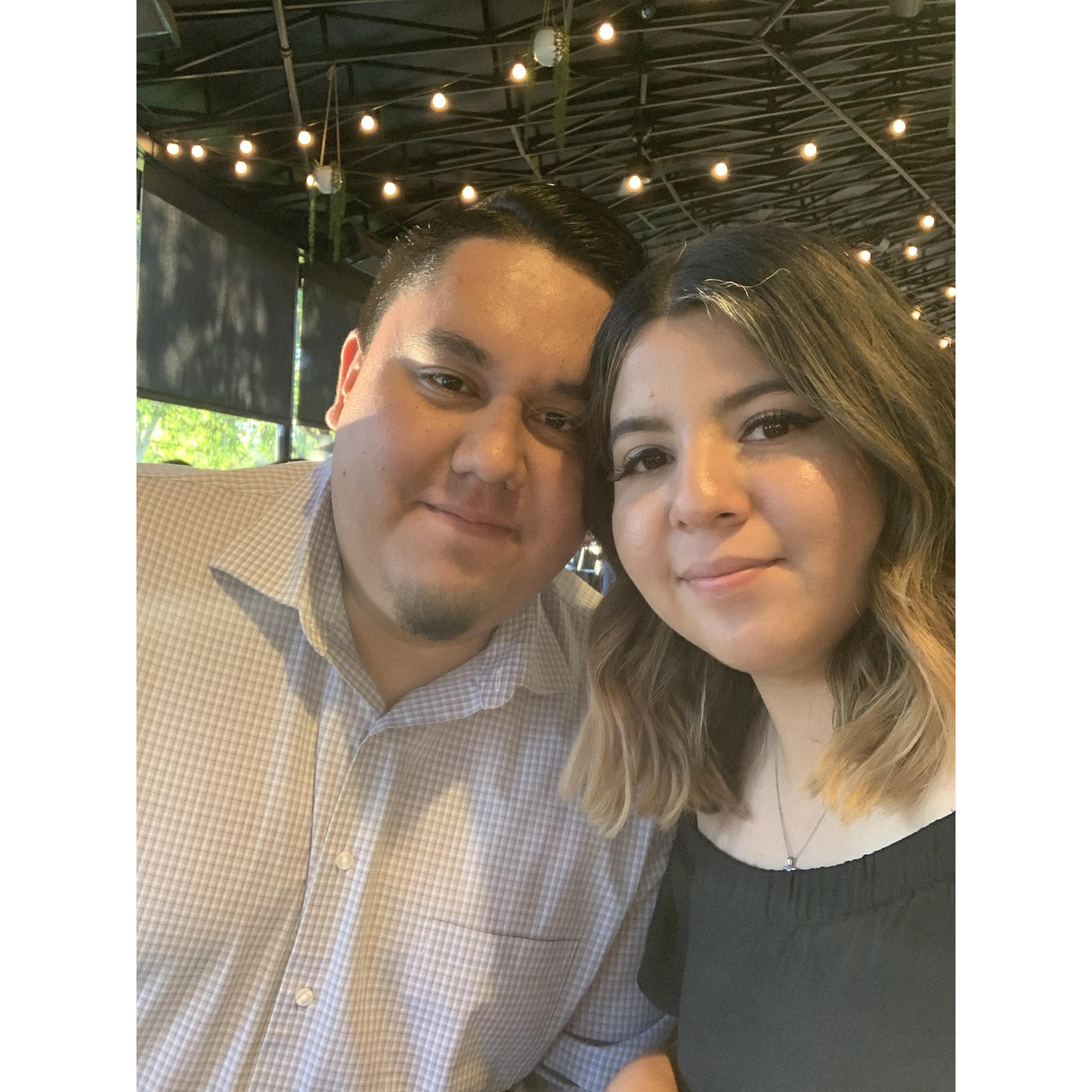Celebrating our engagement at dinner with our families