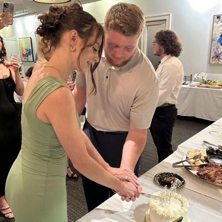 Practicing Our Cake Cutting for the Big Day