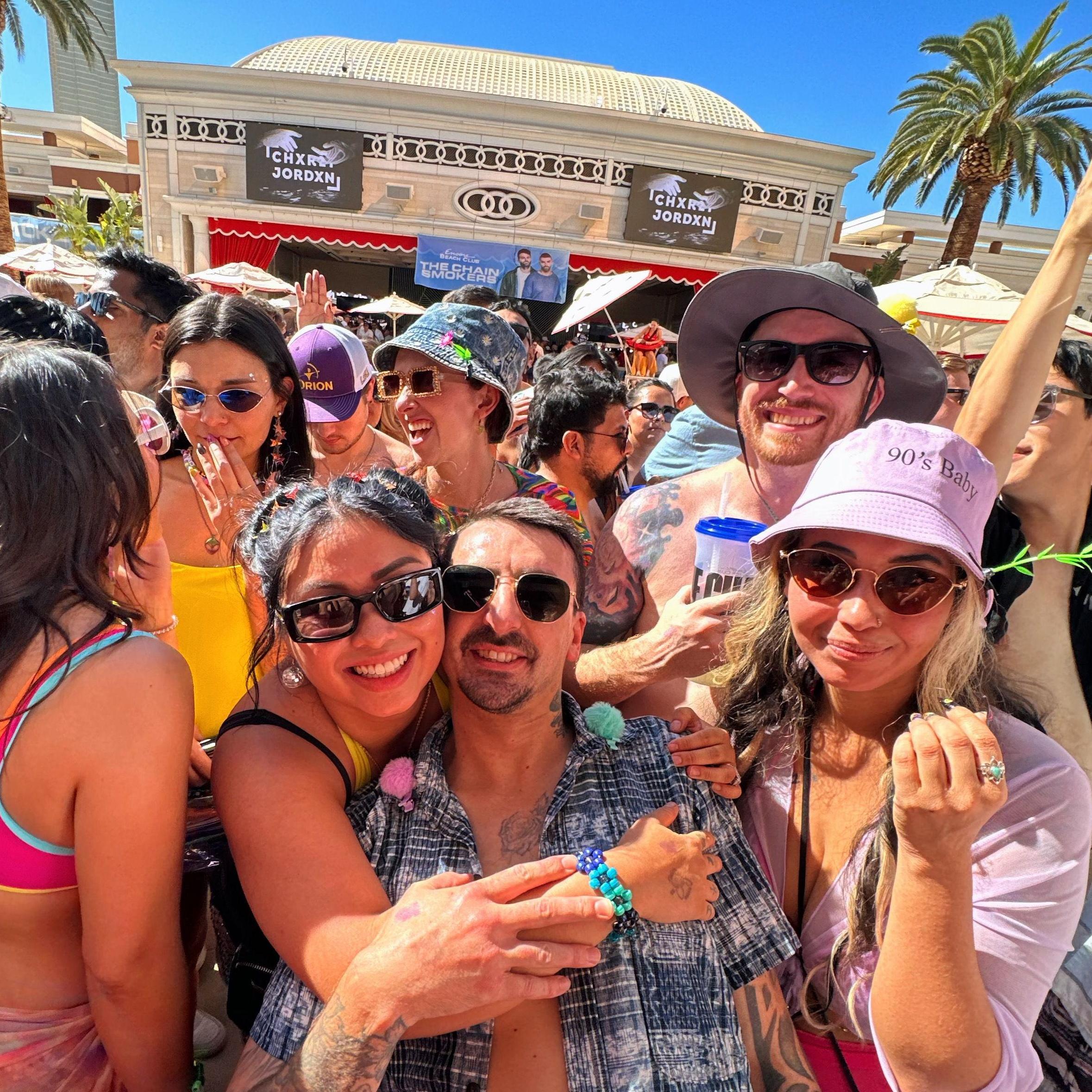 Kolby, and Sara with their friend Matt (grey bucket hat) & Annetta (purple bucket hat) at a Encore Beach Club in 2024.
