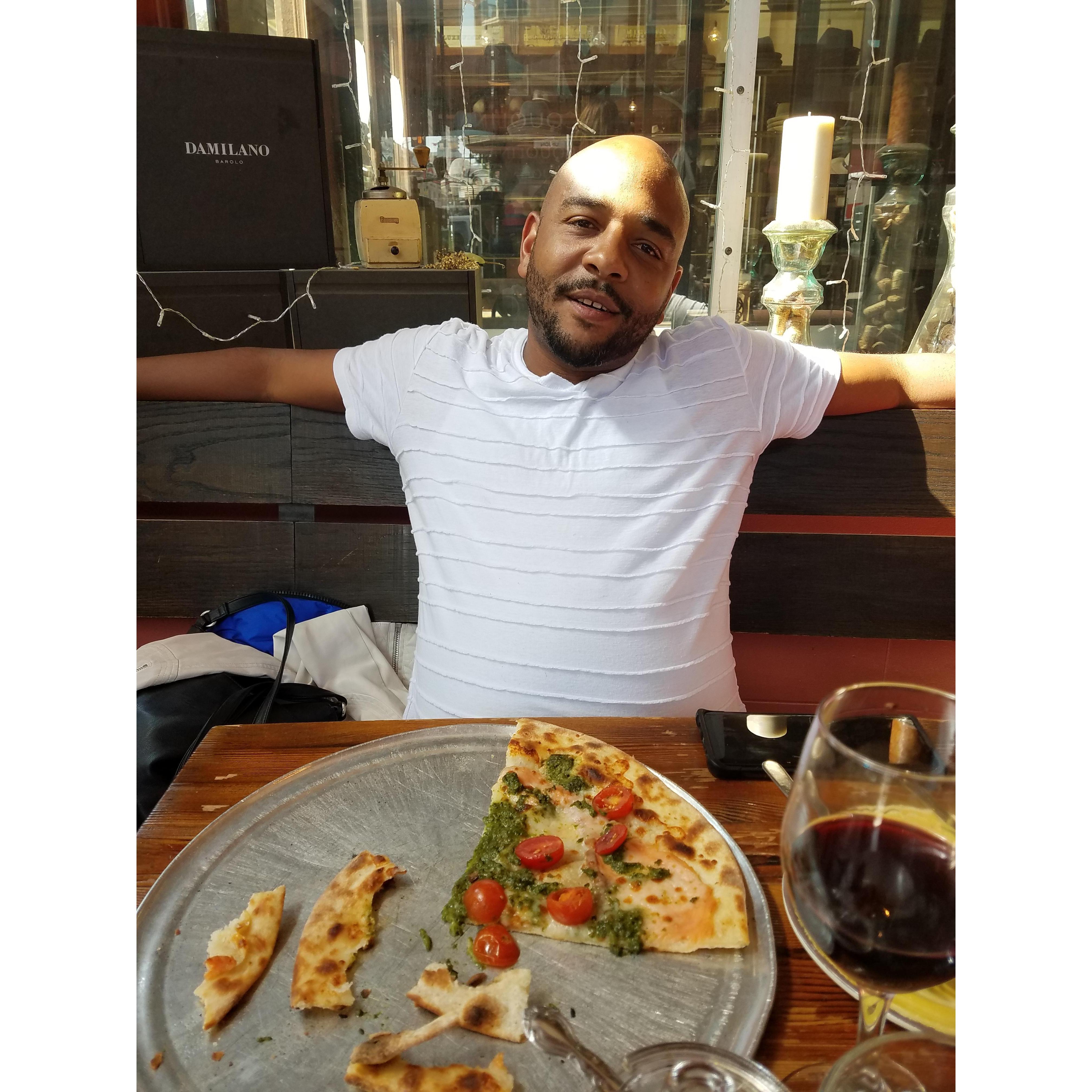 Enjoying pasta and pizza over red wine in Little Italy, San Francisco
