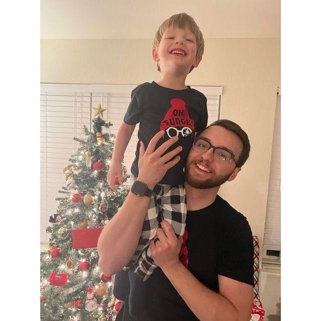 William and Dad in front of our first "BIG BIG BIG" Christmas tree