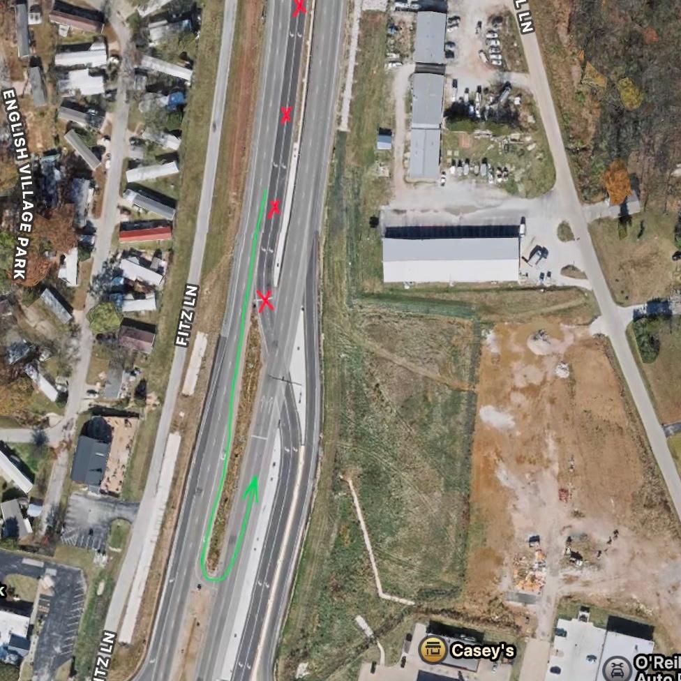 If driving from the north, you cannot turn left into the venue. You have to continue south, past the left turn lanes, to the u-turn lane.