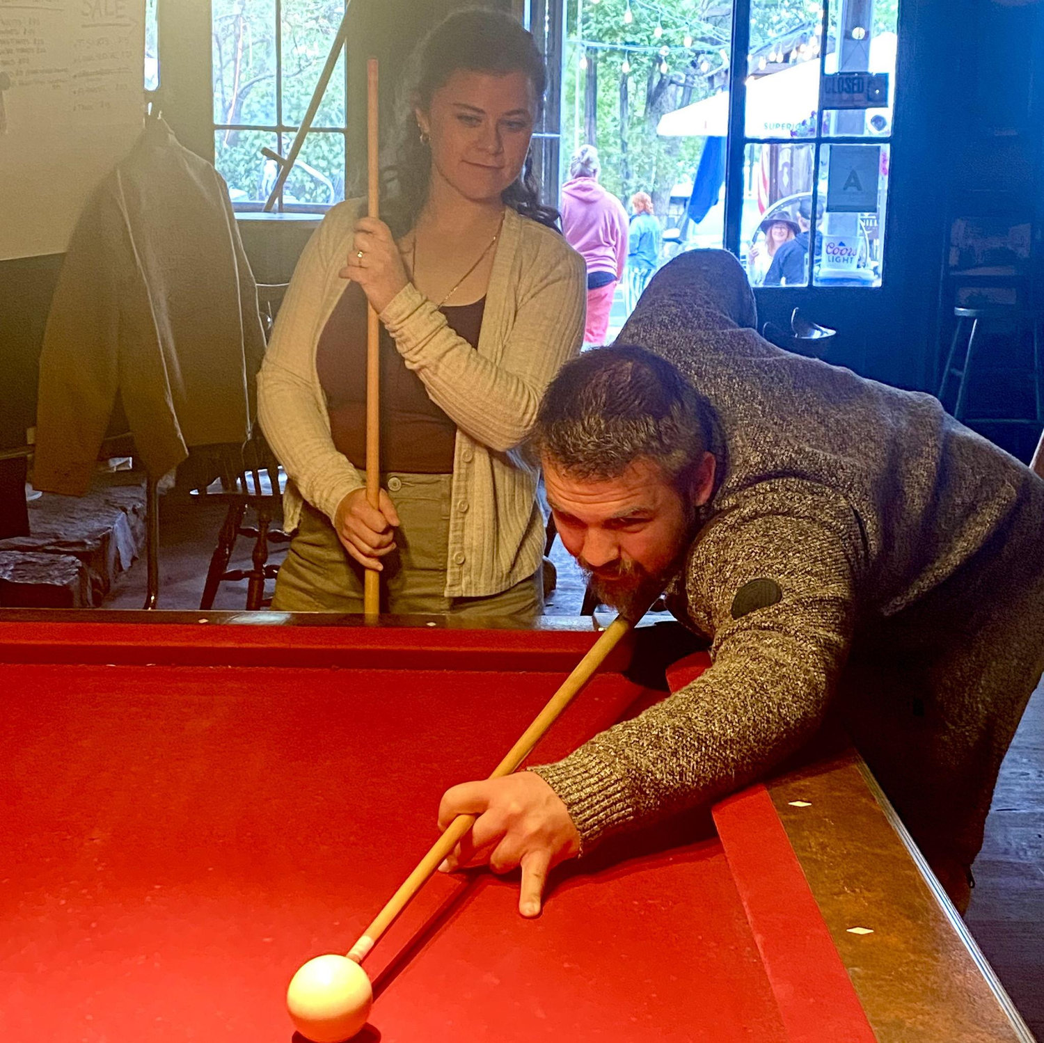 Playing a game (or two) of pool after getting engaged.