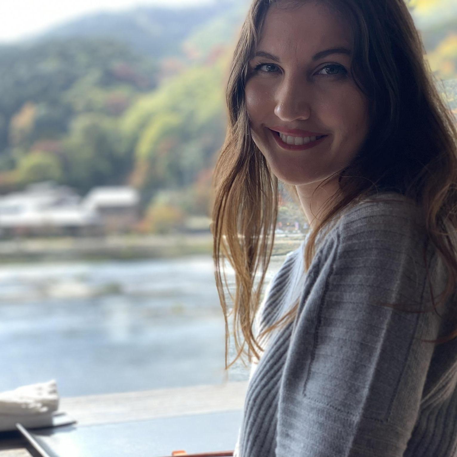 Nicole eating Sushi above the river near Arashiyama, Kyoto, Japan