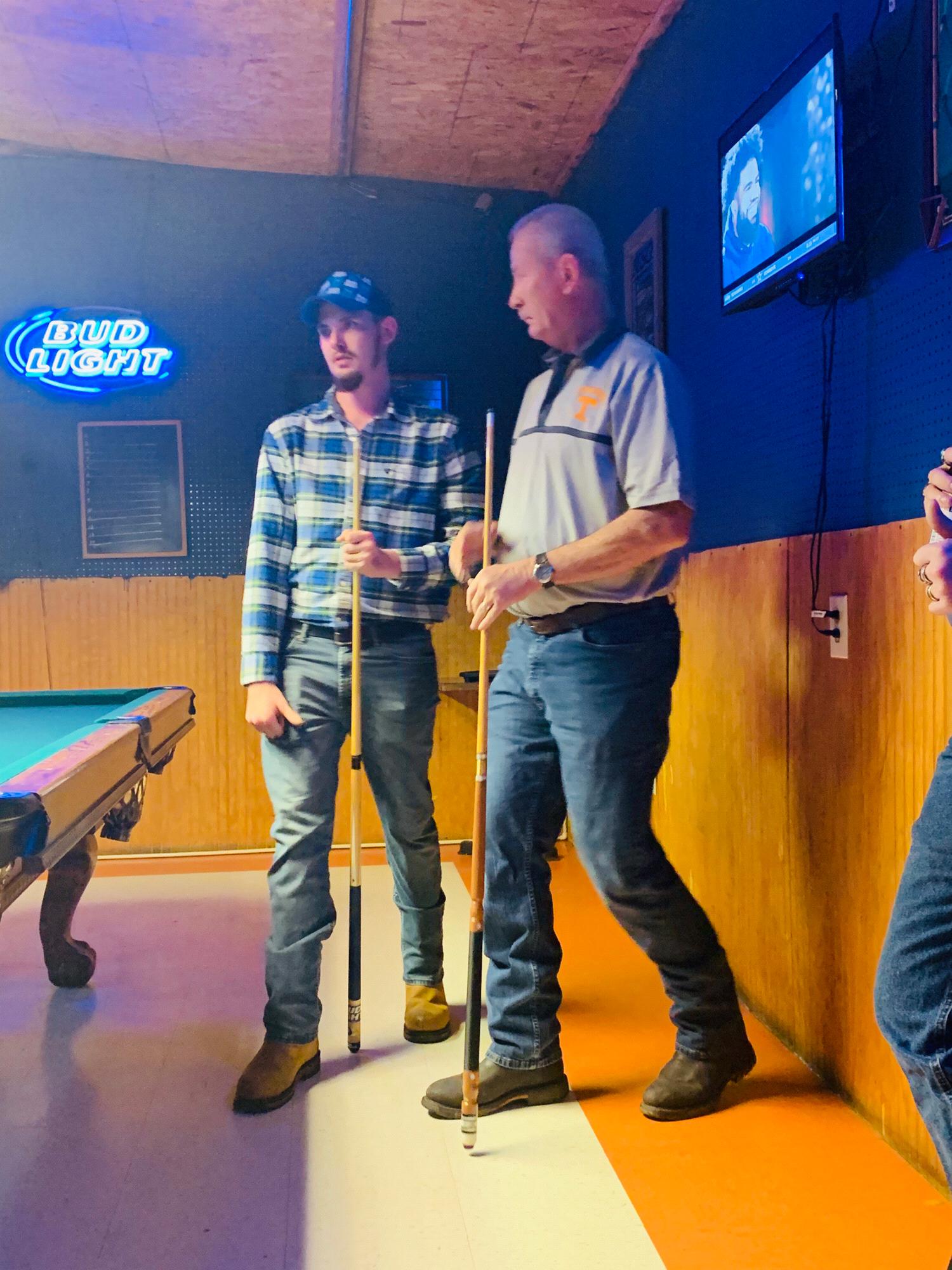 Tyler and His dad playing Pool