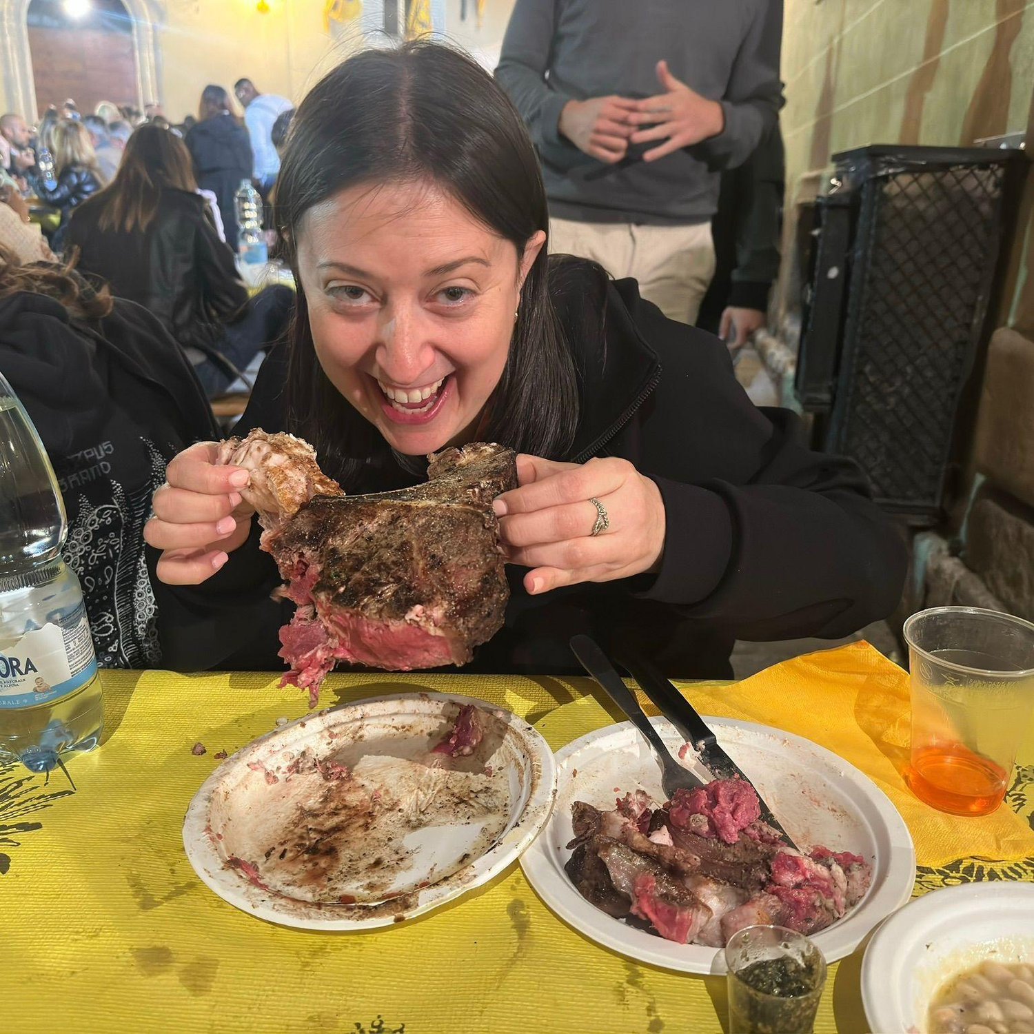 L at a Florence festival, taking on a steak bigger than her appetite. Bold move… but she always bites off exactly what she wants.