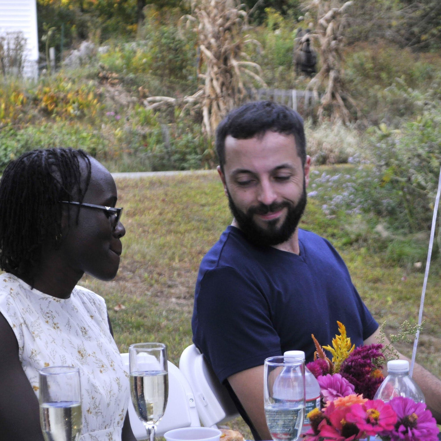 Warren looking at Lidia in response to a speech delivered at the engagement party.