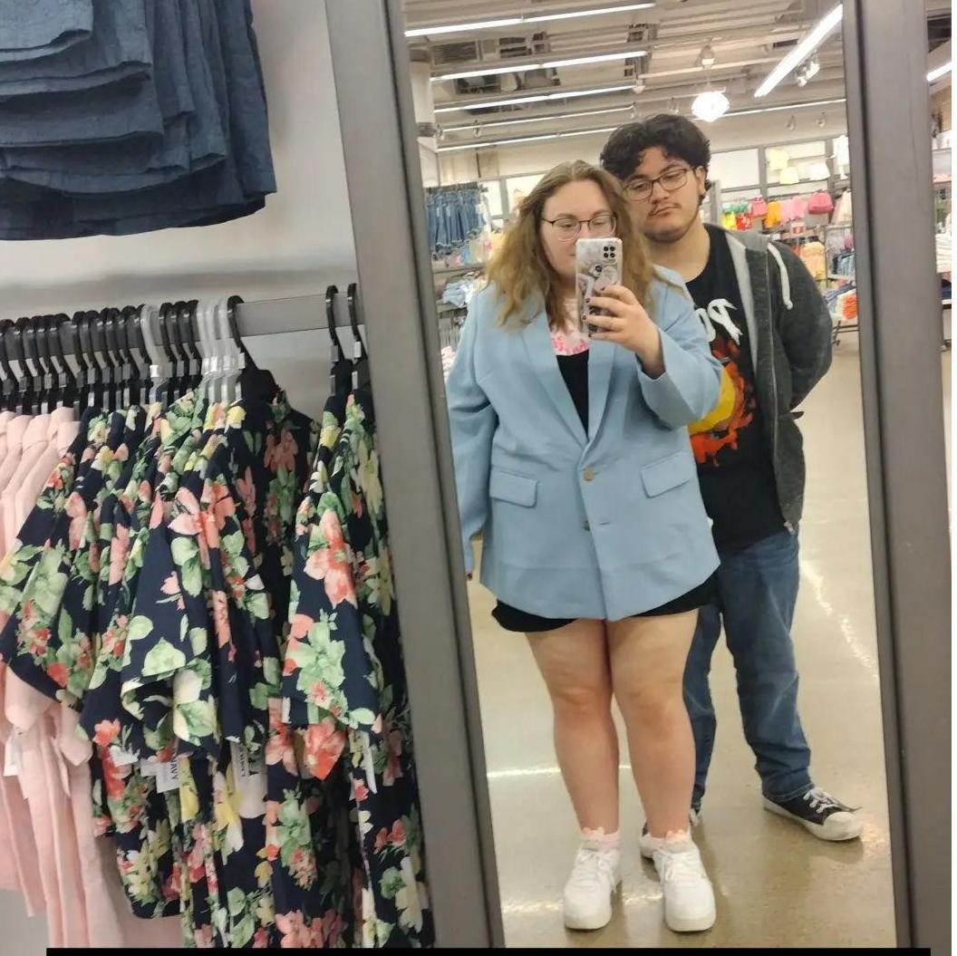 Picture we took on a date trying on clothes for fun