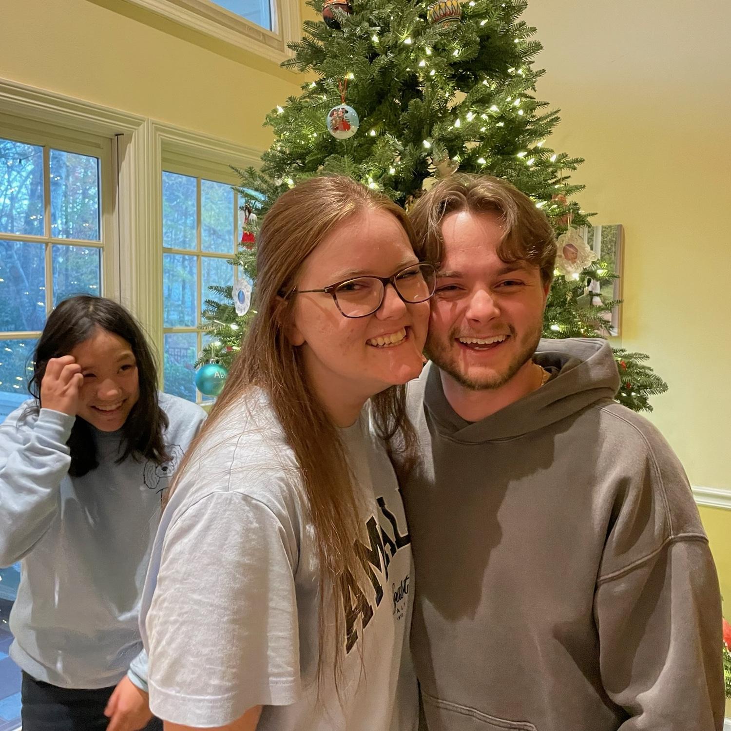 One of many first holiday photos together. Abbie , Liz's sister, with the photo bomb.