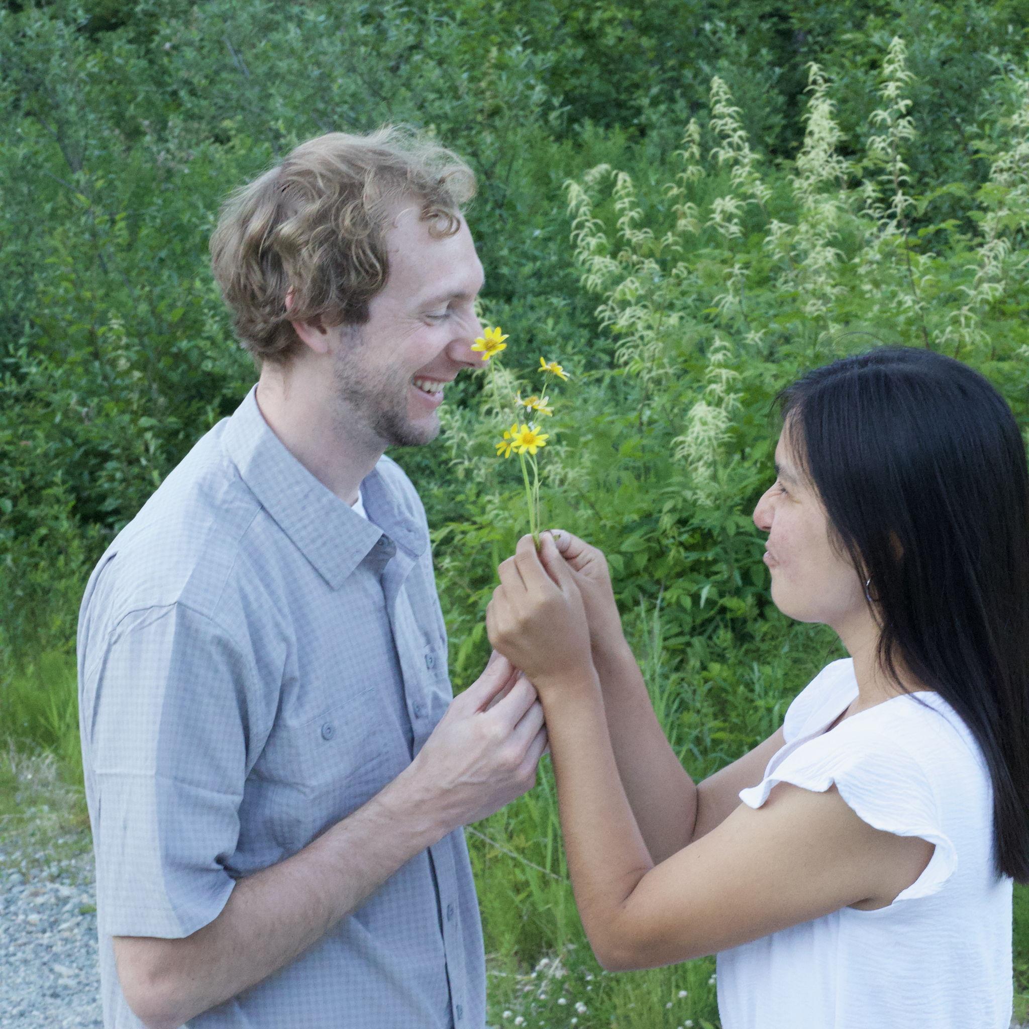 here let me just stick this flower up your nose. don't mind me