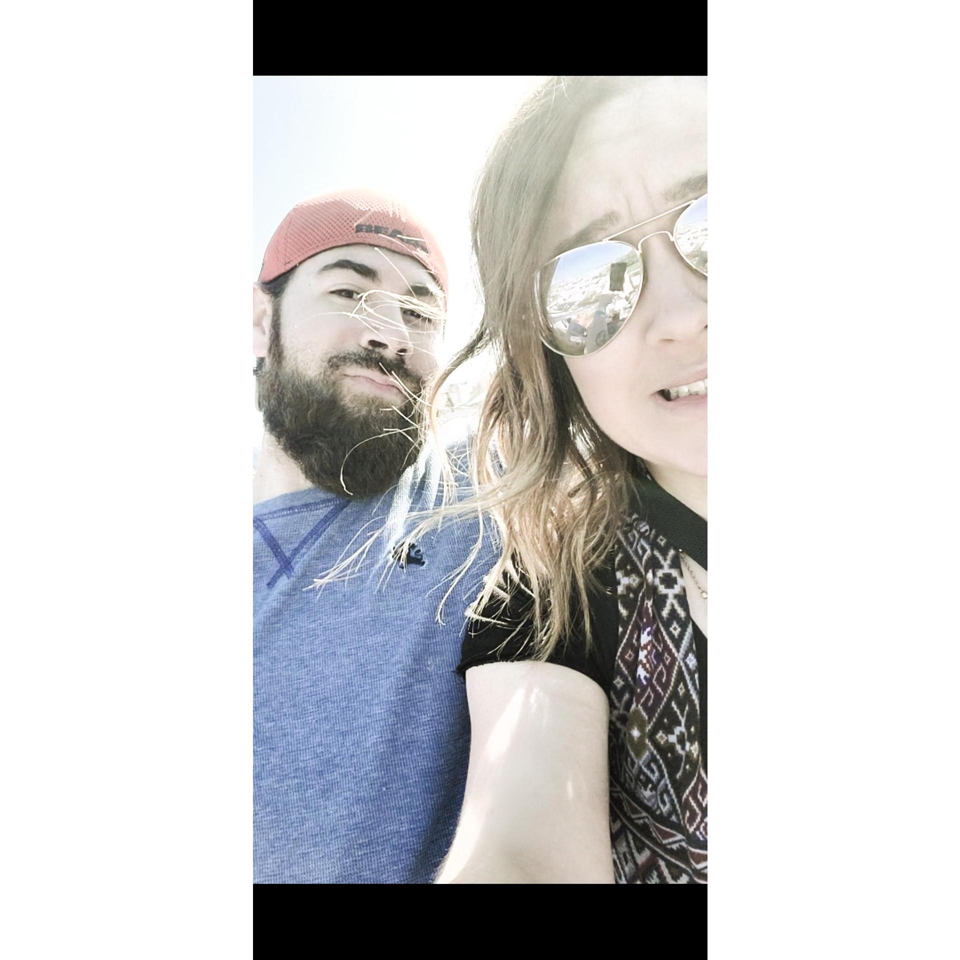 Our first ferris wheel ride together...on top of a very high building. My face says it all.