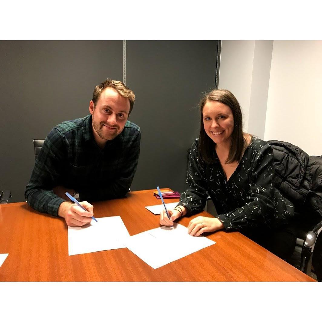 Signing the paperwork for our house! December 2018