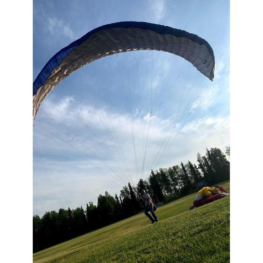 Paragliding at the park near our house.