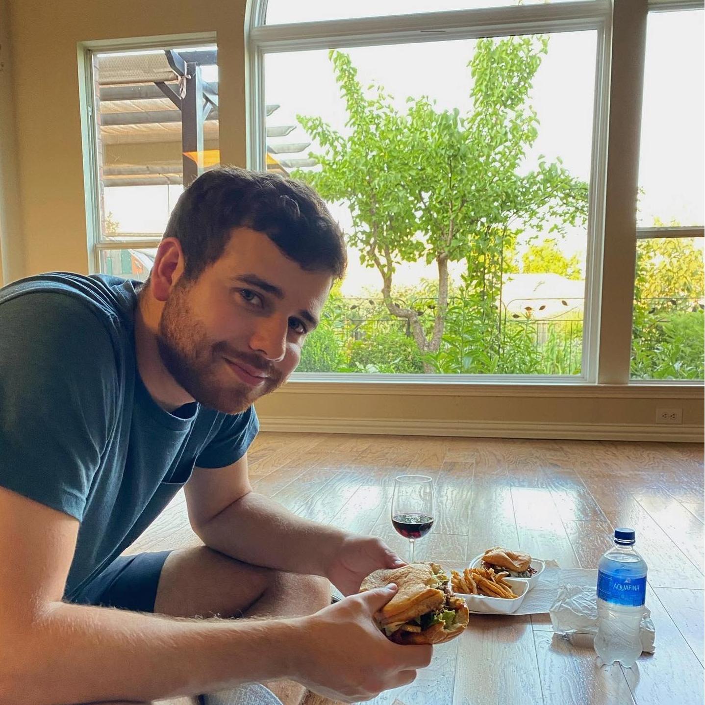 We bought our first house together in 2021! Our first meal in the new home was some boxed wine and to-go burgers. We've loved turning this house into our home!