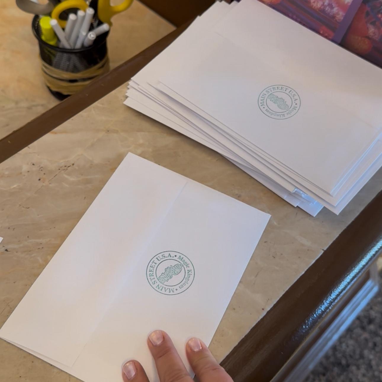 Check out your save-the-date envelope! Each was stamped and mailed from Walt Disney World. Every envelope showcases this fancy stamp from Main Street in Magic Kingdom!