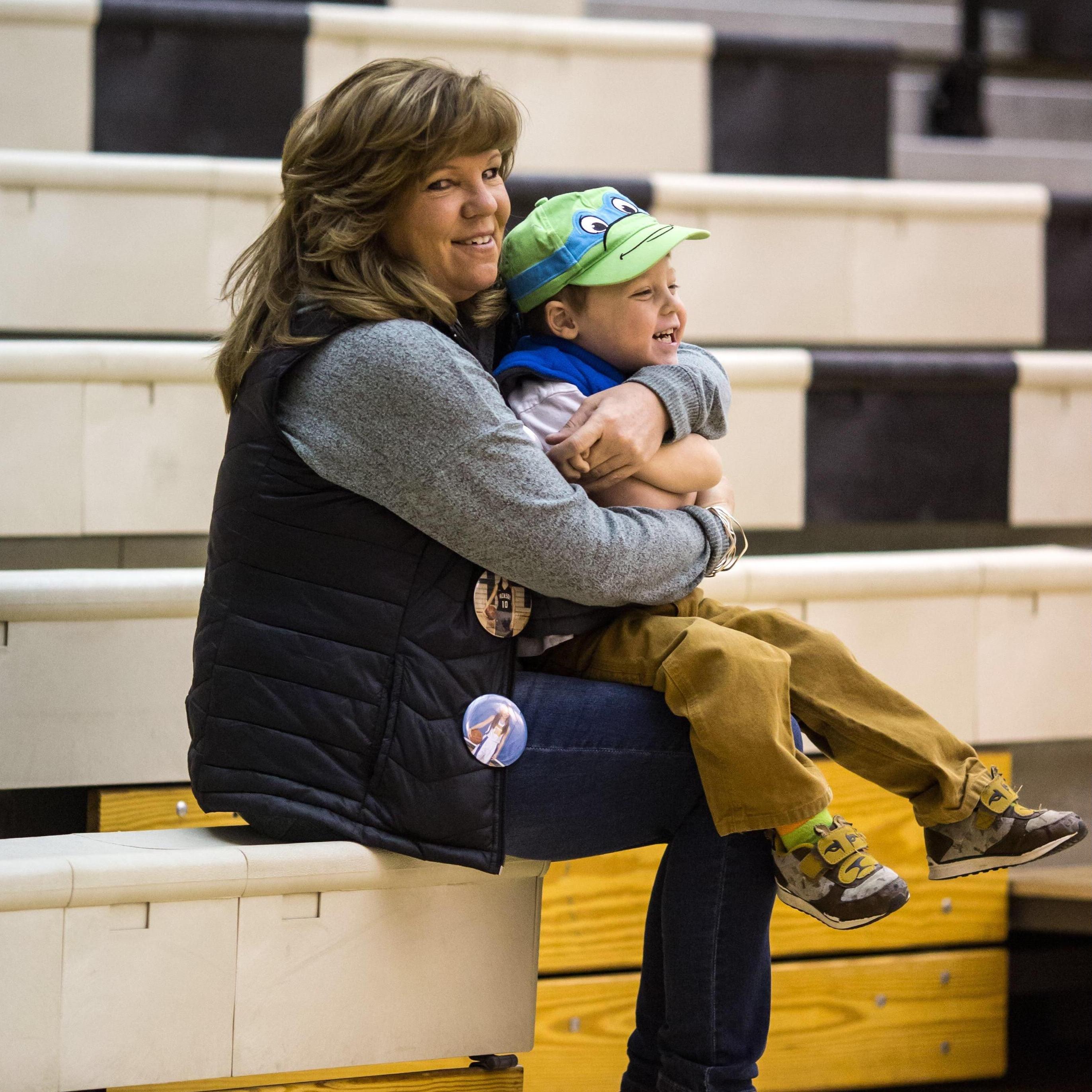 Paxton and his Grandma Jeanette at a basketball game