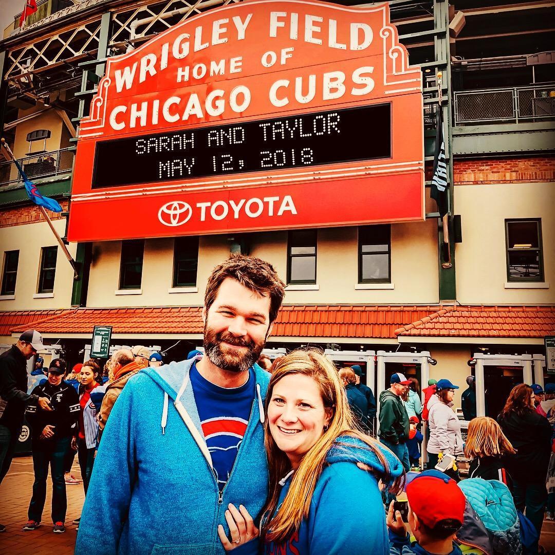 Taylor asked and Sarah said yes in front of Wrigley Field!