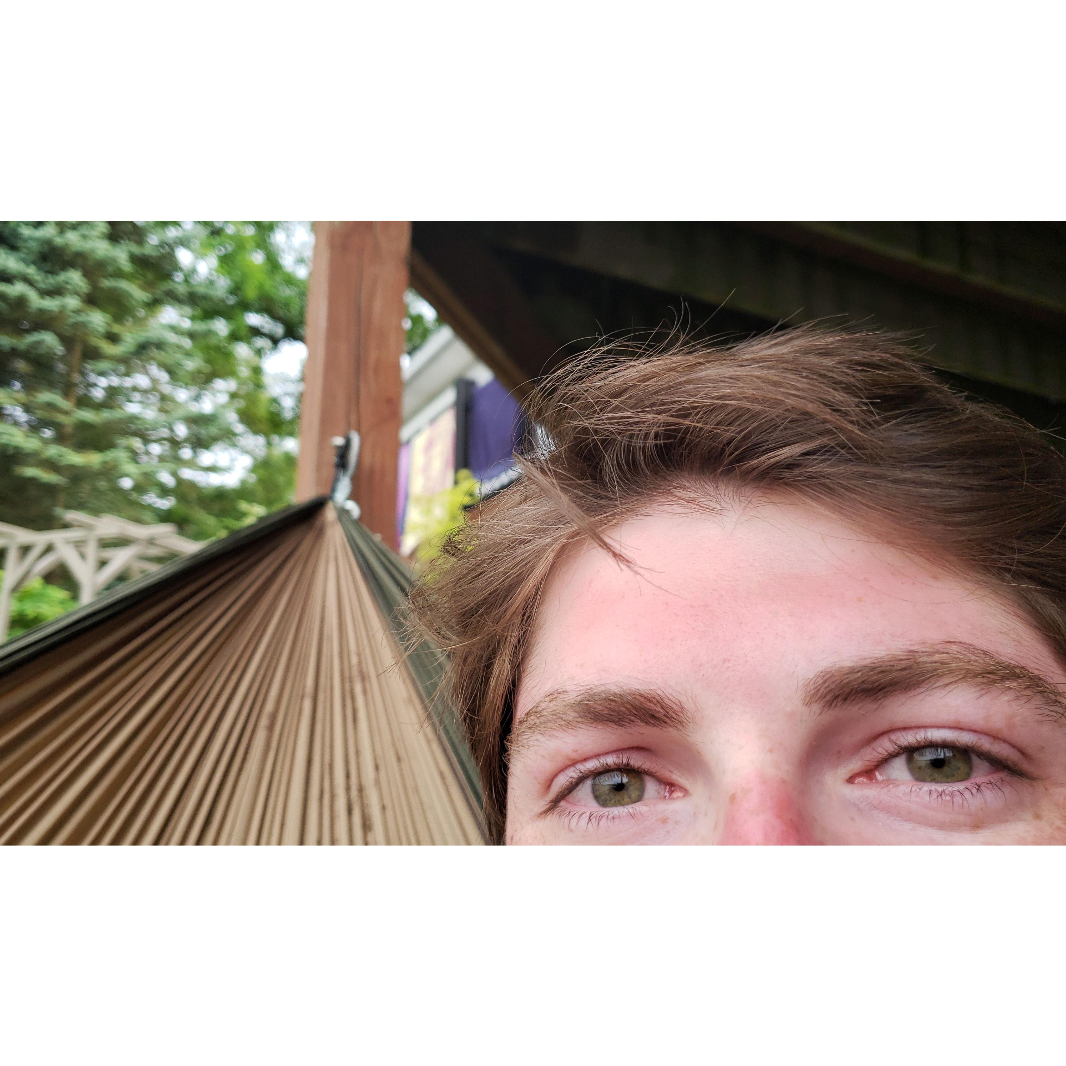 a sun-kissed Kyle in a hammock