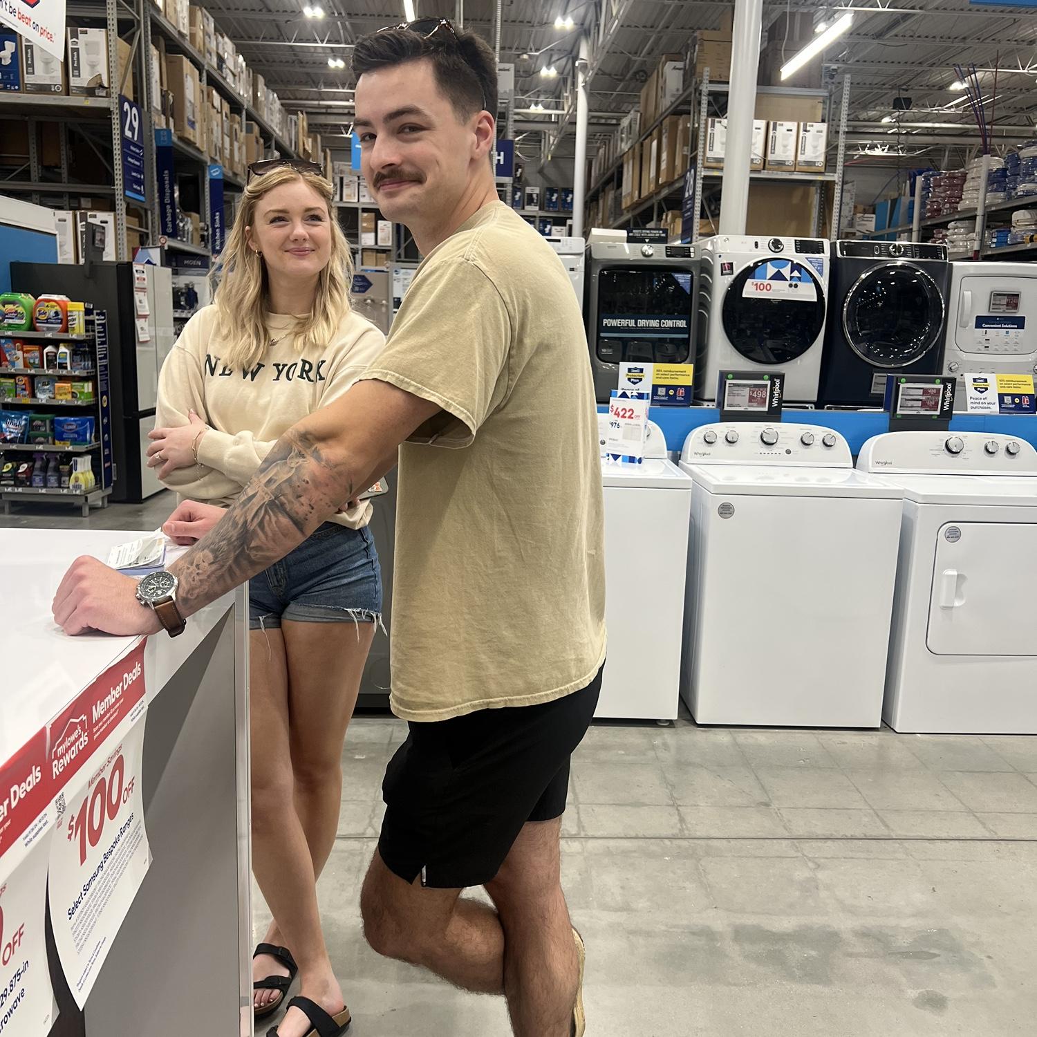 Our officiant (and bestie) Matt, snapped this as Sam was purchasing our first washer and dryer for the house🥺