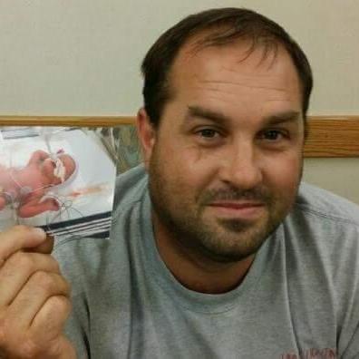 July 31, 2014 - The moment Mike found out Alaina & I both made it out of delivery safe. He was not allowed to go in during the c-section due to the high risk.