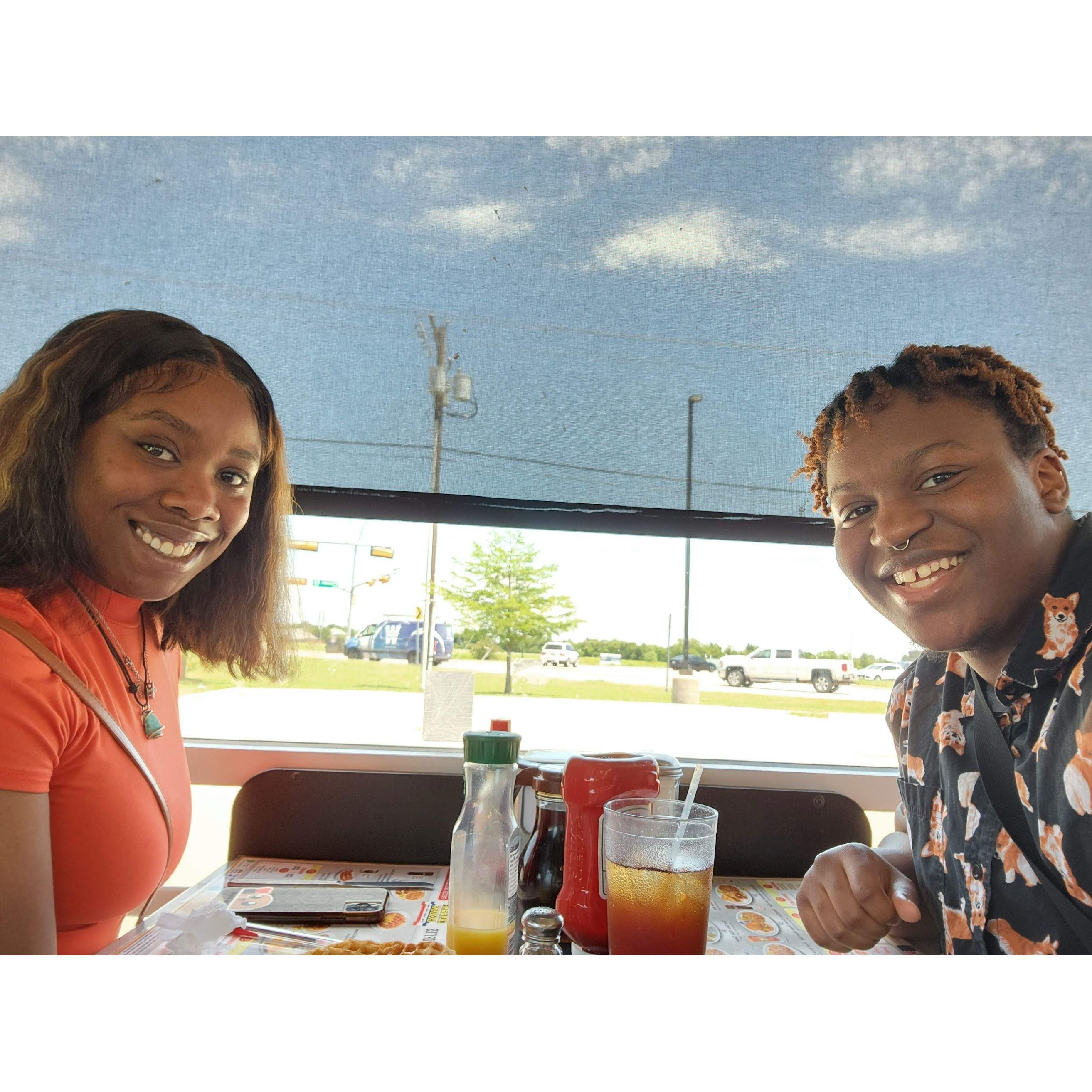 Our first flight together, eating at a Waffle House in Dallas