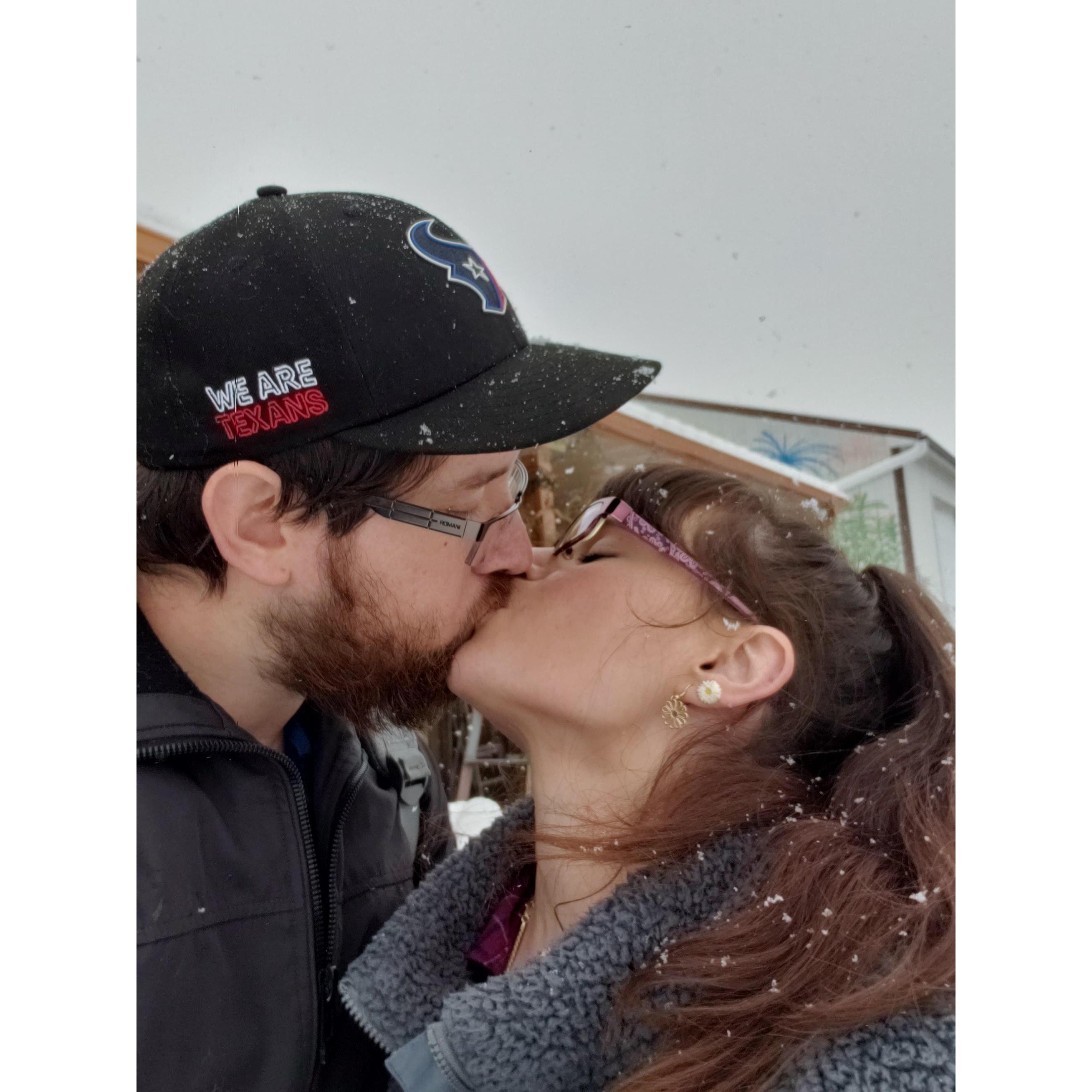 Kisses in the snow make the cold air feel bearable.