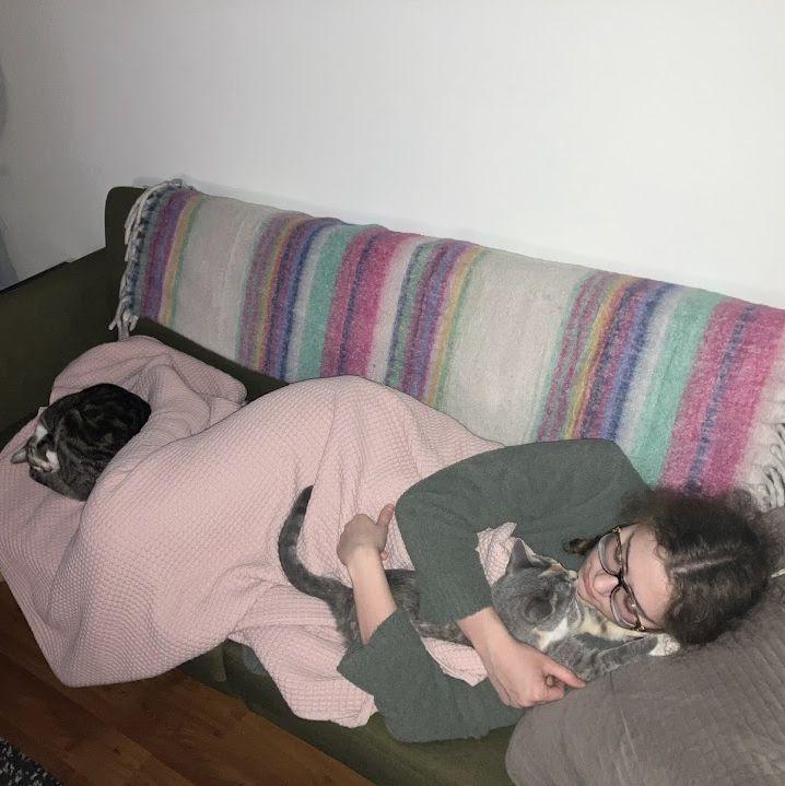 Lola sleeping with the two kitty babies